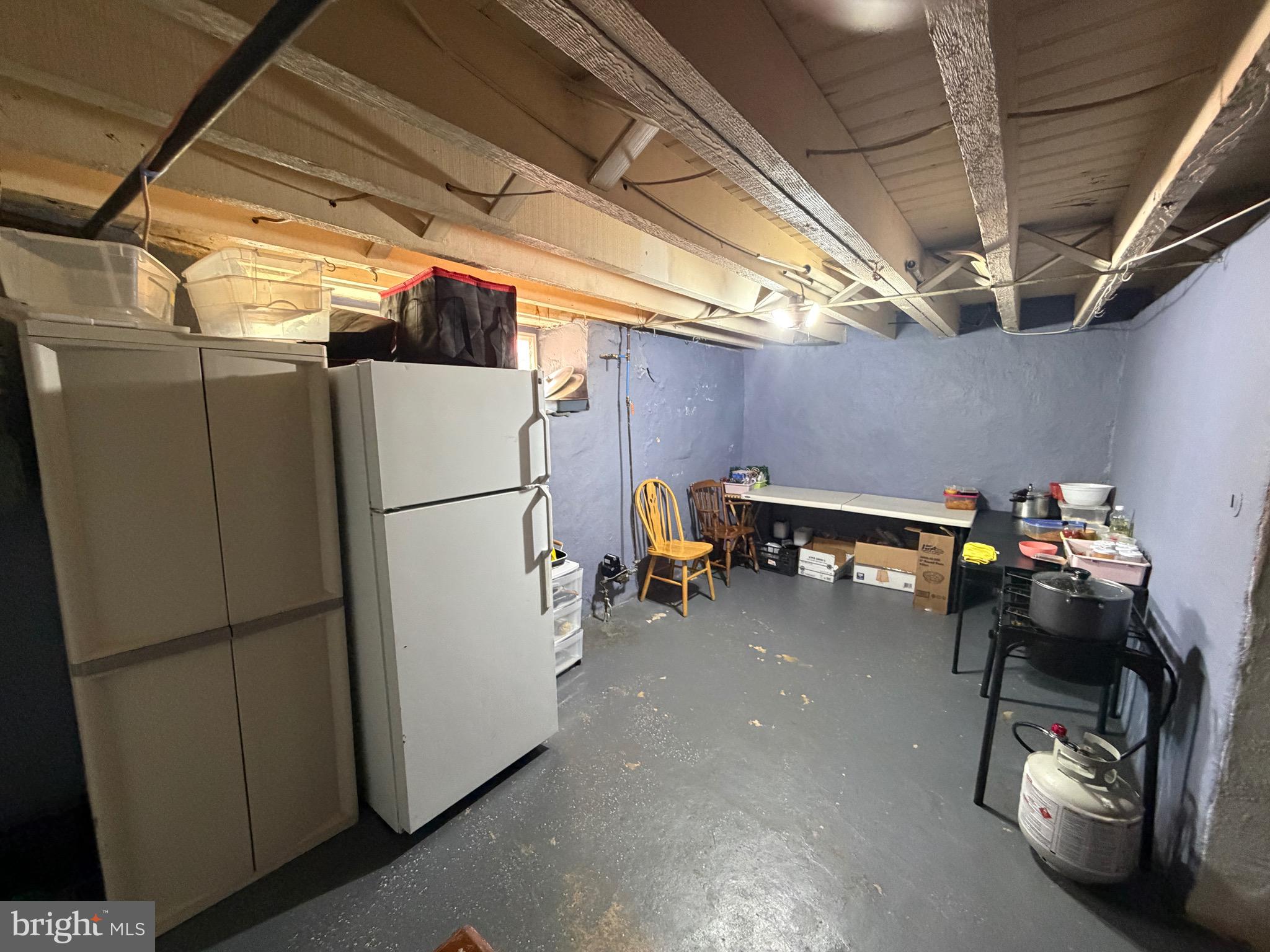 4317 Chippendale Street Philadelphia, PA 19136 - Photo 11 of 11 a view of storage and utility room with refrigerator washer and dryer