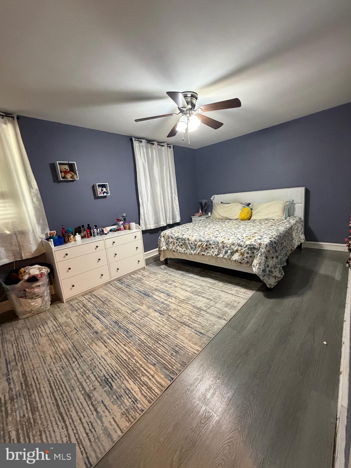 4317 Chippendale Street Philadelphia, PA 19136 - Photo 8 of 11 a bedroom with a bed and a chandelier