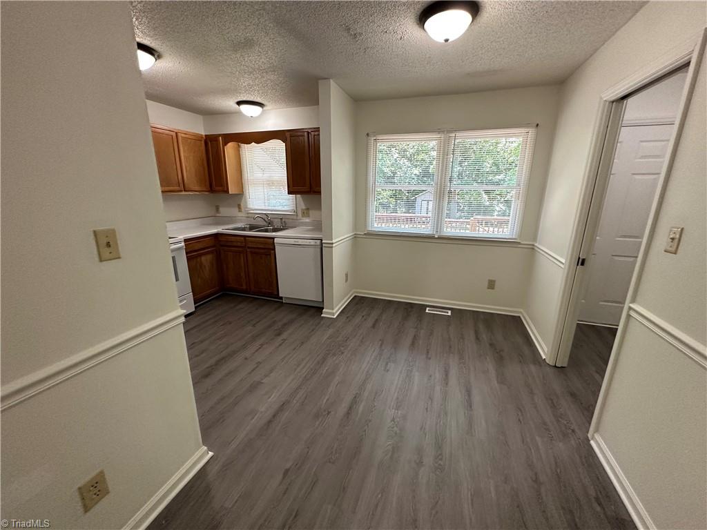 109 Pineview Road Gibsonville, NC 27249 - Photo 14 of 28 New glue down vinyl plank flooring in kitchen