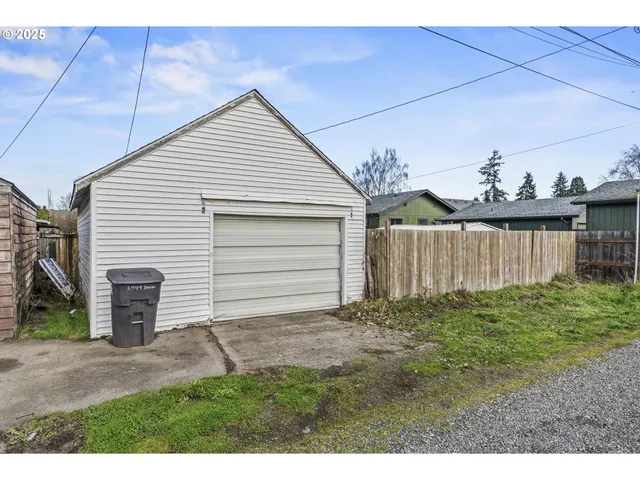 a view of a house with a yard and garage