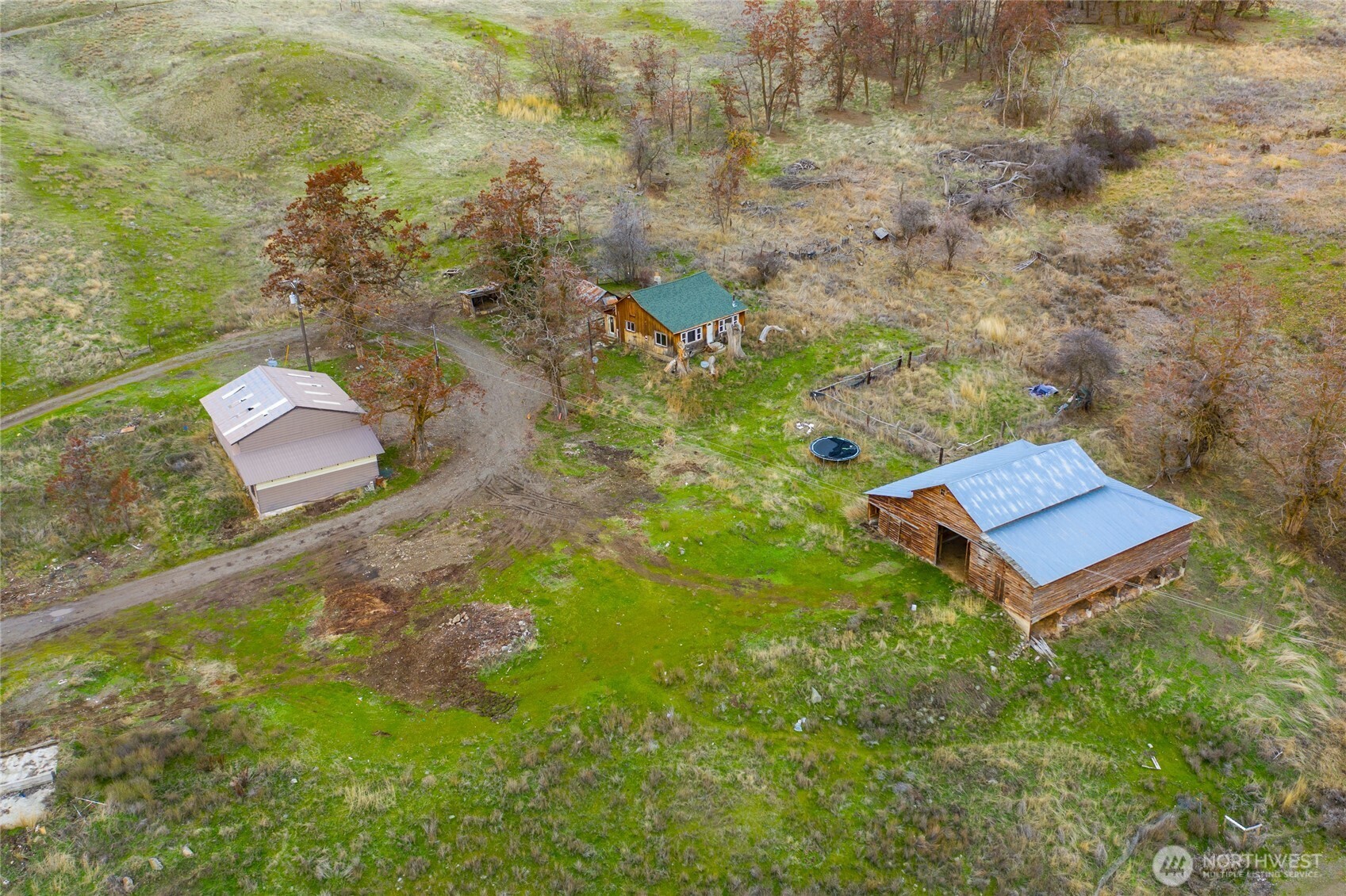 4521 Highway 25 South Hunters, WA 99137 - Photo 22 of 36 a view of a bench in the garden