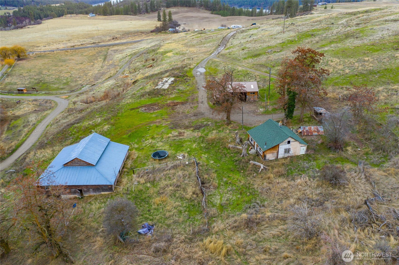 4521 Highway 25 South Hunters, WA 99137 - Photo 24 of 36 a view of a yard with an outdoor space