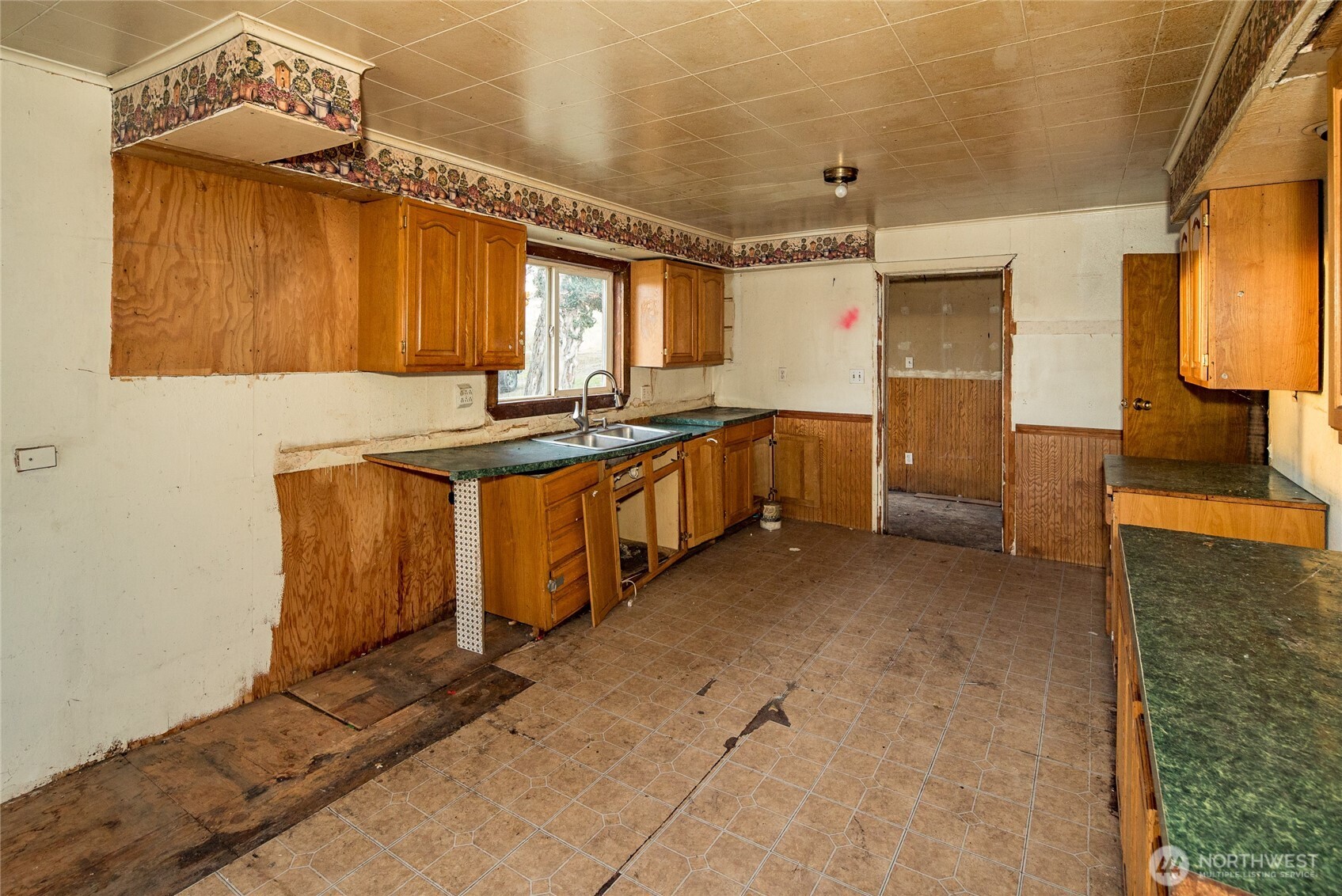 4521 Highway 25 South Hunters, WA 99137 - Photo 32 of 36 a kitchen with sink cabinets and stove