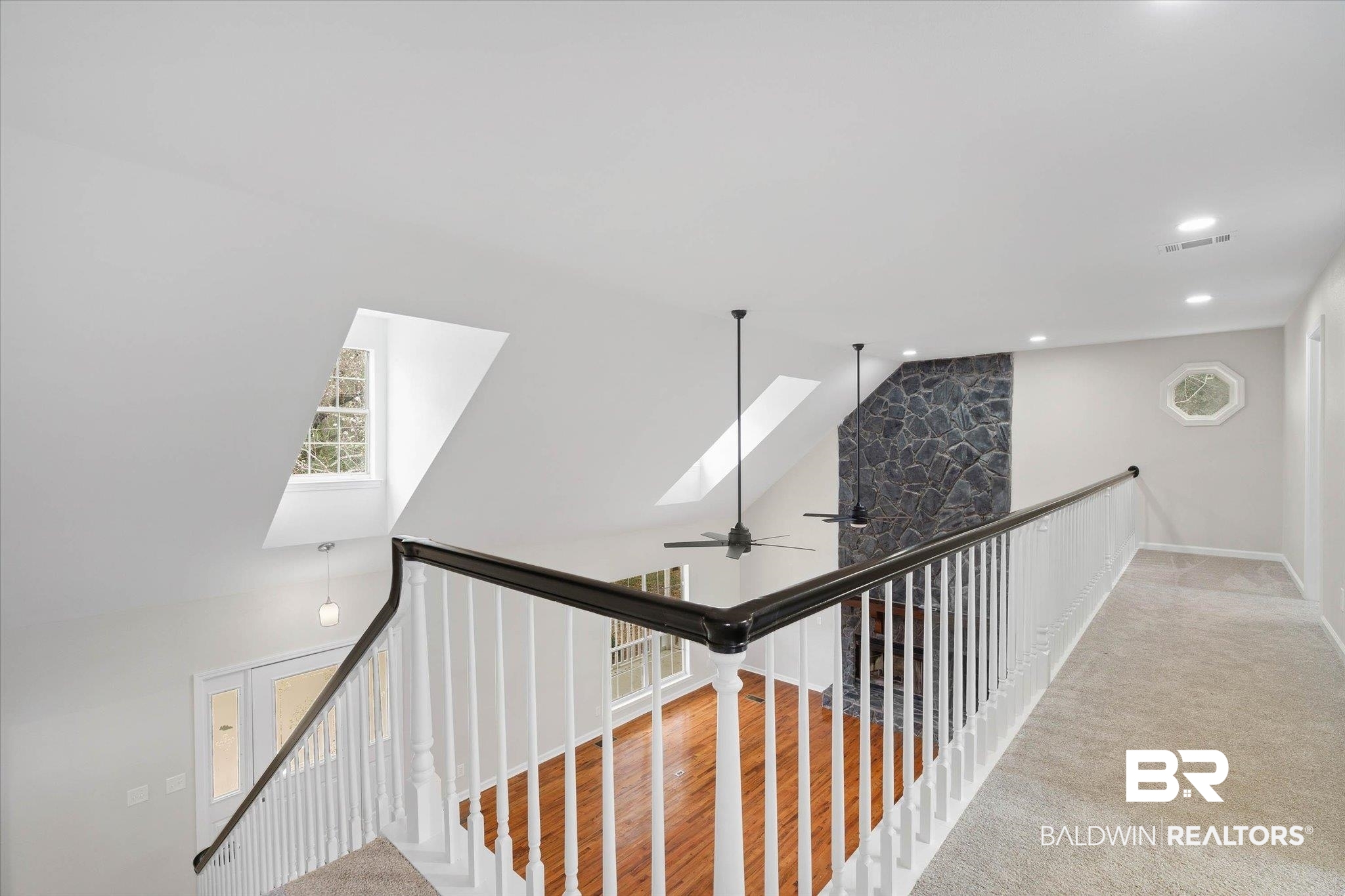 106 Melanie Loop Daphne, AL 36526 - Photo 21 of 45 Corridor featuring lofted ceiling, a skylight, and recessed lighting