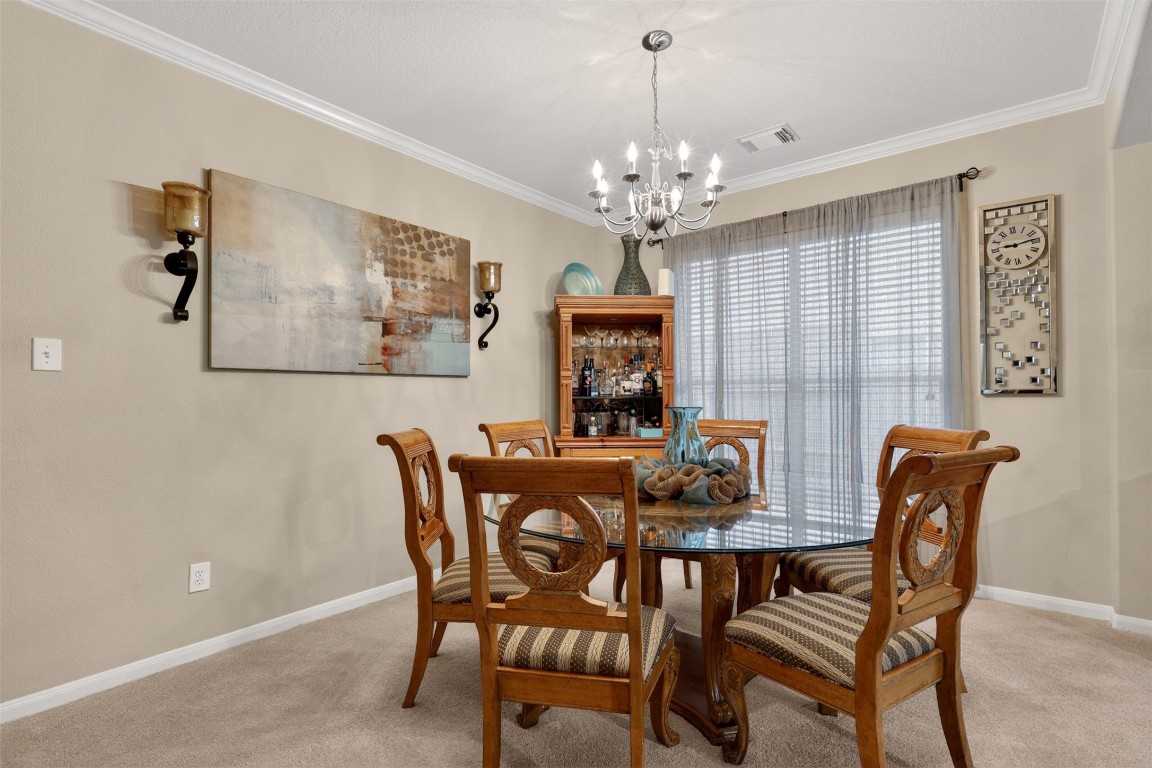 25710 Crisp Spring Lane Spring, TX 77373 - Photo 11 of 37 Formal Dining Room (Traditional)
Formal dining space with chandelier lighting, perfect for hosting gatherings and special occasions.