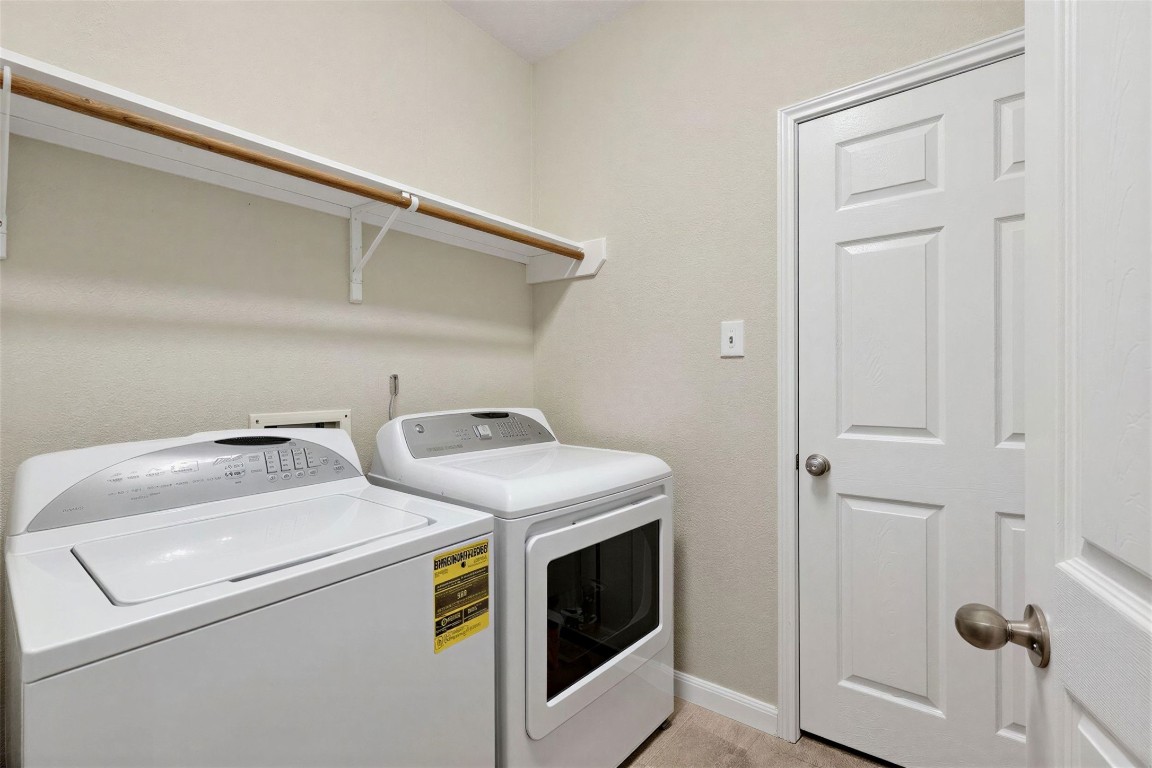 25710 Crisp Spring Lane Spring, TX 77373 - Photo 18 of 37 Laundry Room (View 2)
Functional utility space with washer/dryer connections and additional storage options.