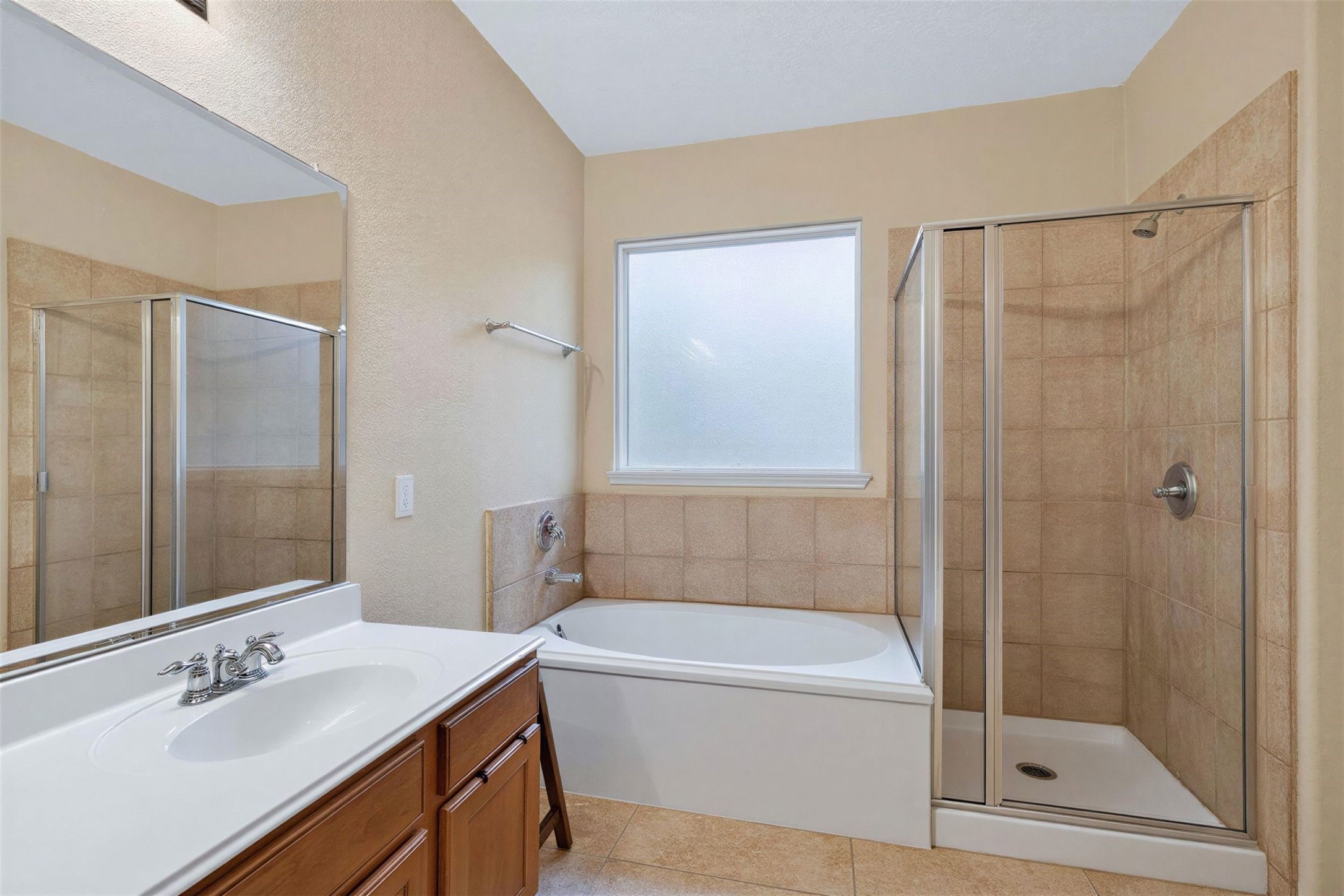 25710 Crisp Spring Lane Spring, TX 77373 - Photo 21 of 37 Primary Bathroom
Relaxing primary bath with soaking tub, separate shower, and generous space for everyday comfort.