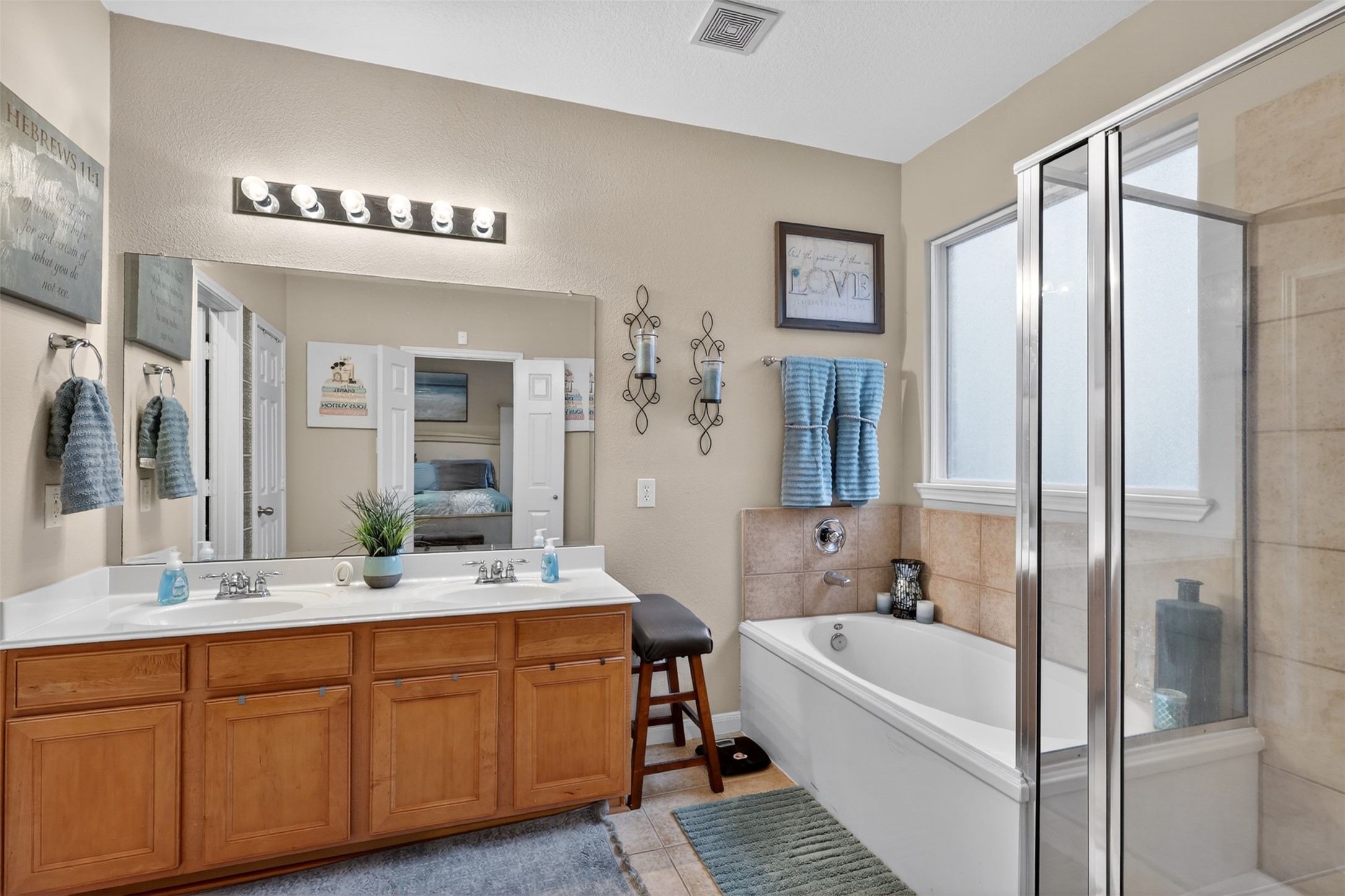 25710 Crisp Spring Lane Spring, TX 77373 - Photo 22 of 37 Primary Bathroom (View 1)
Well-appointed primary bath with dual vanities, large soaking tub, separate glass-enclosed shower, and ample counter space.