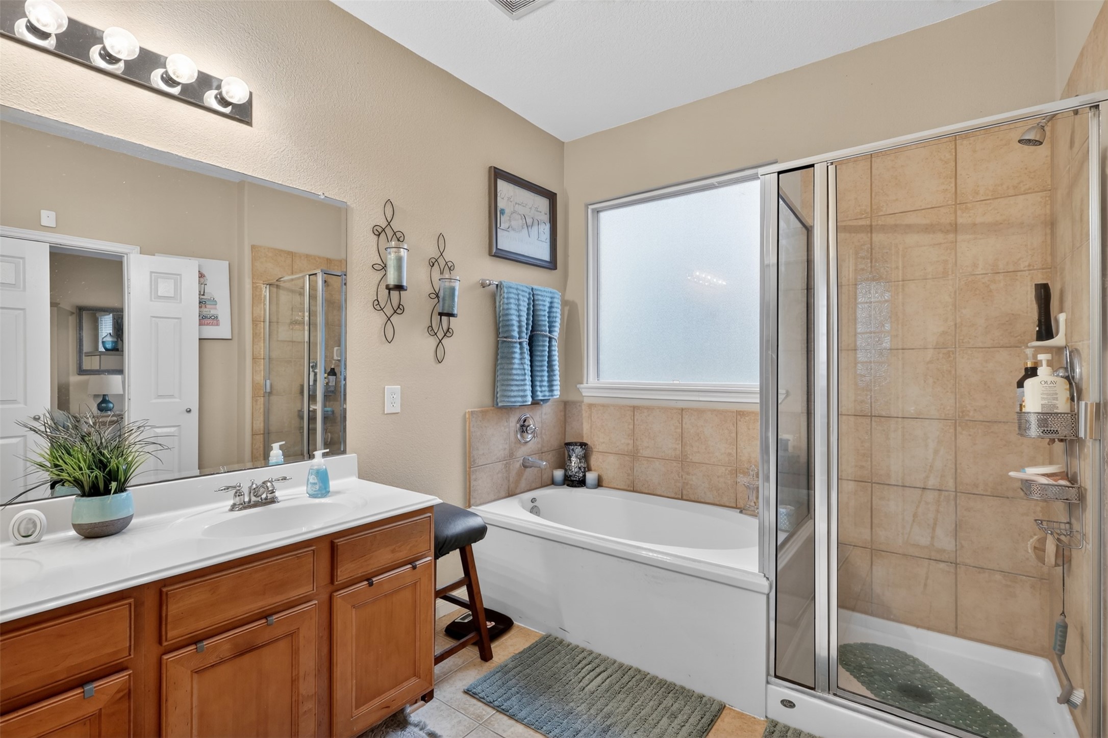 25710 Crisp Spring Lane Spring, TX 77373 - Photo 23 of 37 Primary Bathroom (View 2)
Additional view highlighting the spacious layout, natural lighting, and relaxing spa-like atmosphere.