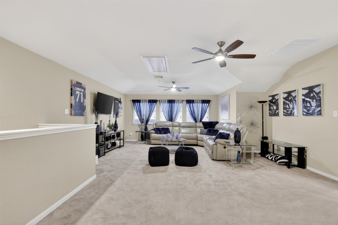 25710 Crisp Spring Lane Spring, TX 77373 - Photo 24 of 37 Upstairs Game Room / Flex Space (View 1)
Expansive game room with vaulted ceilings, neutral finishes, and flexible layout—ideal for entertaining, media, or family gatherings.
