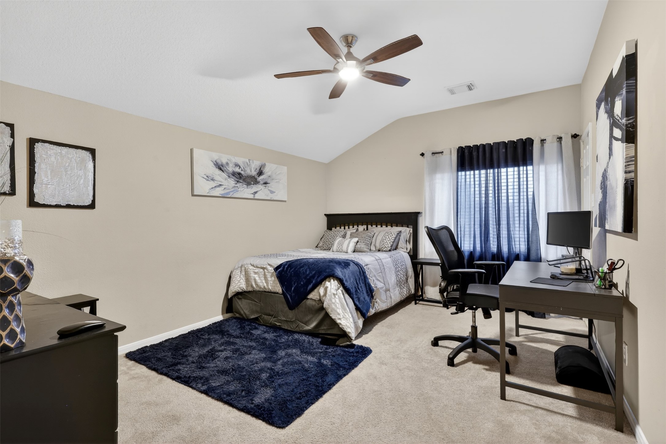 25710 Crisp Spring Lane Spring, TX 77373 - Photo 27 of 37 Upstairs Secondary Bedroom / Office
Versatile secondary bedroom with natural light—perfect for guests, a home office, or study space.
