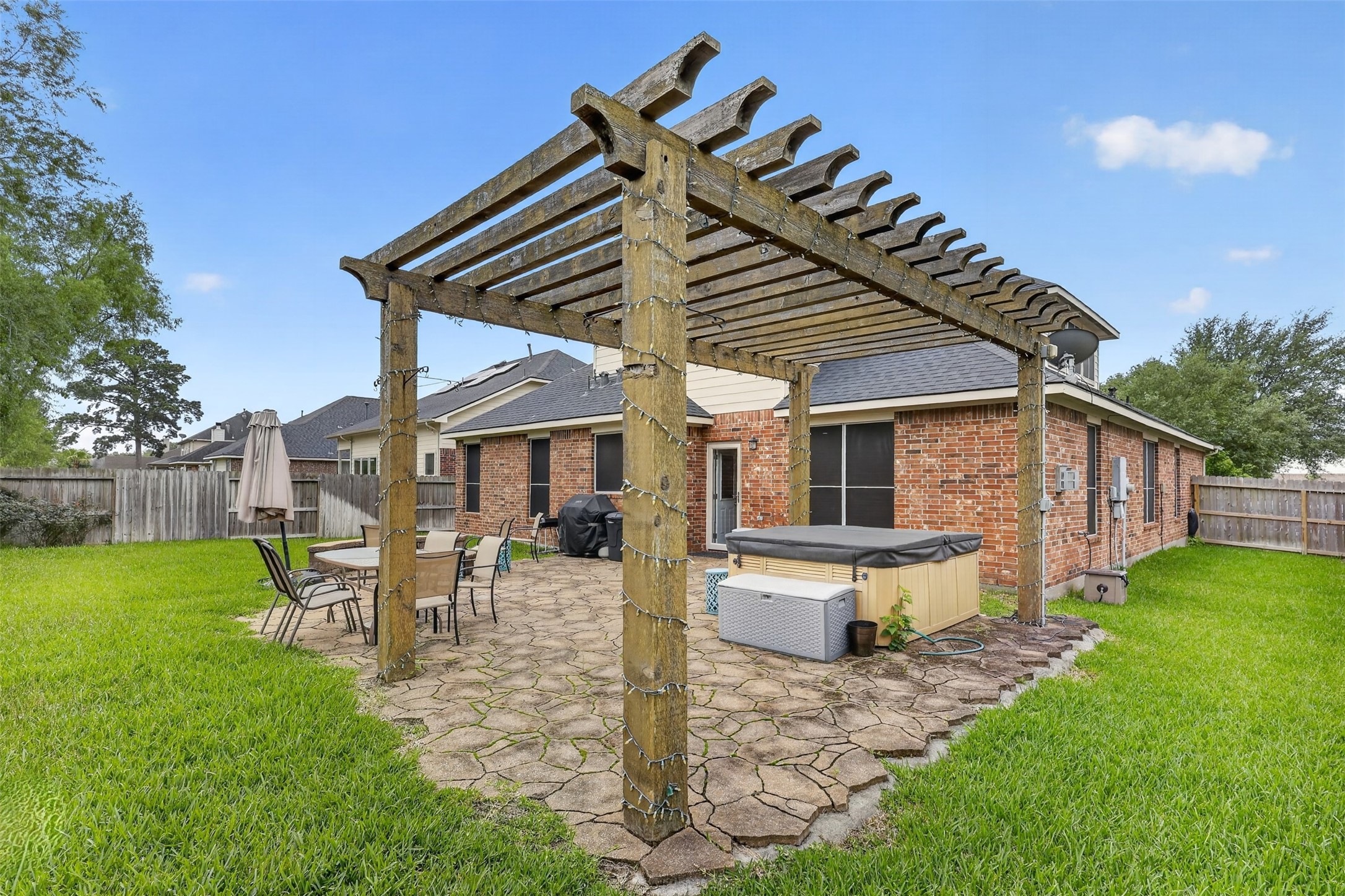 25710 Crisp Spring Lane Spring, TX 77373 - Photo 28 of 37 Backyard Pergola (Rear View)
Rear view of the pergola and patio space showcasing the home’s exterior and backyard functionality.