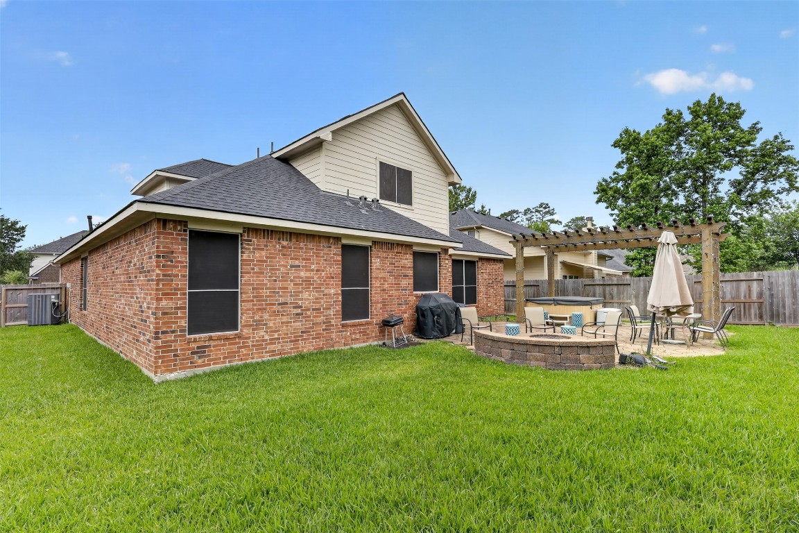 25710 Crisp Spring Lane Spring, TX 77373 - Photo 29 of 37 Backyard Full View
Large, fully fenced backyard offering privacy, green space, and multiple areas for relaxation and entertainment.
