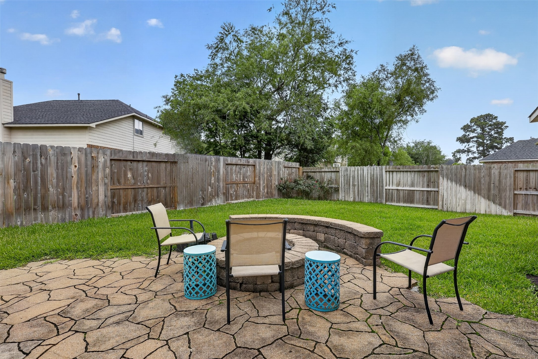 25710 Crisp Spring Lane Spring, TX 77373 - Photo 30 of 37 Backyard Fire Pit Area
Relaxing backyard retreat featuring a built-in fire pit seating area—perfect for gatherings and evenings outdoors.