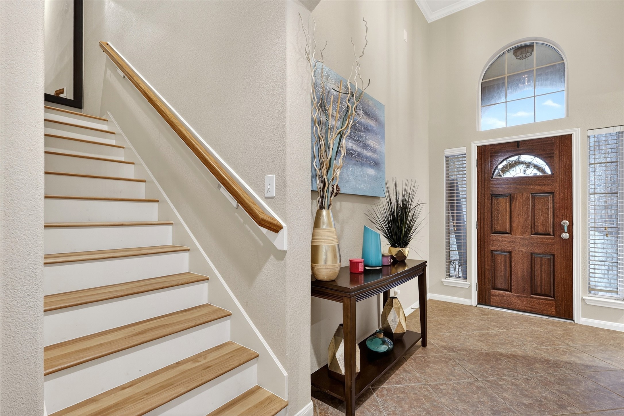 25710 Crisp Spring Lane Spring, TX 77373 - Photo 3 of 37 Entryway & Staircase
Grand entry featuring soaring ceilings, elegant staircase, and decorative niche—creating a warm first impression.