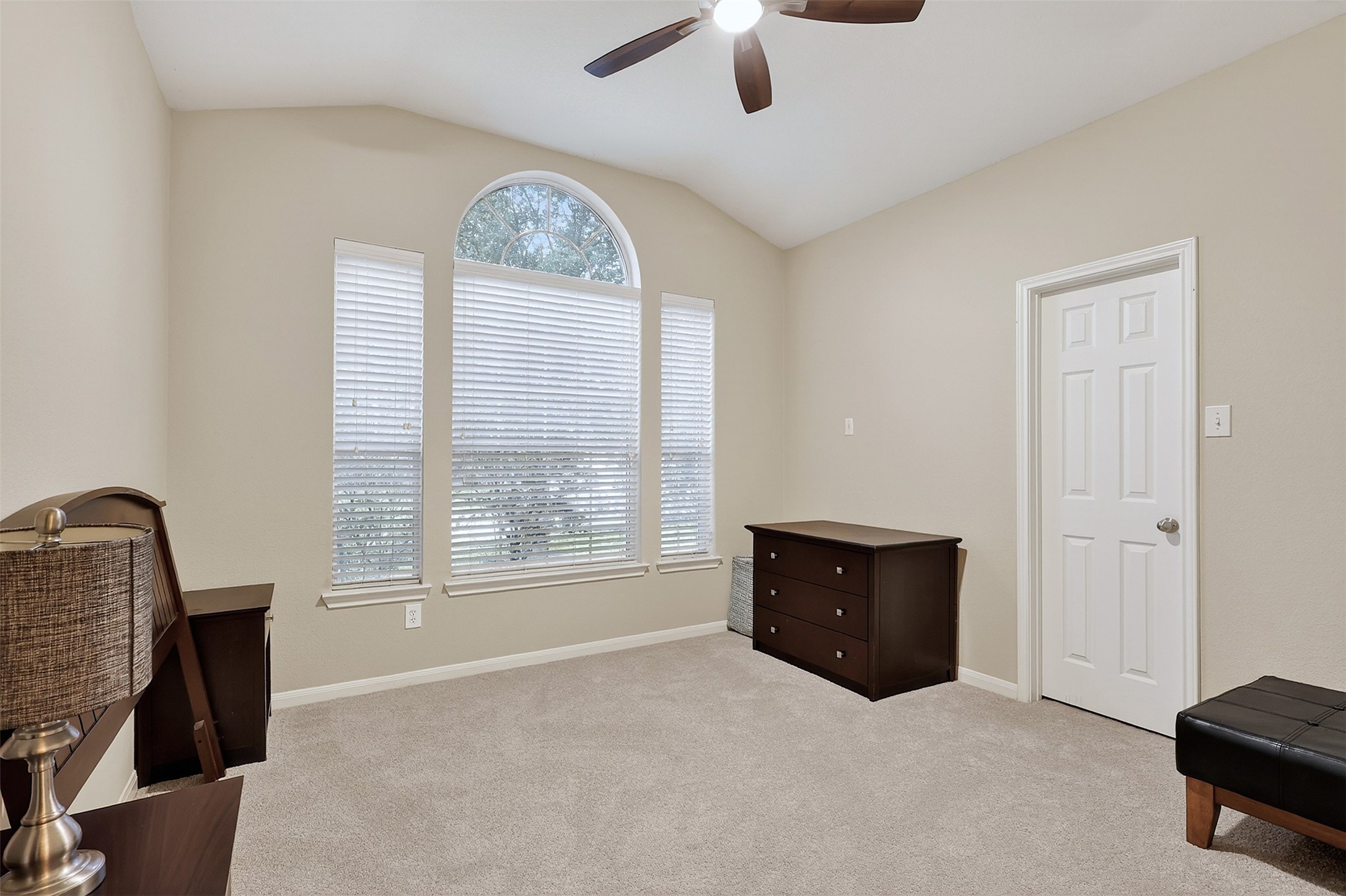25710 Crisp Spring Lane Spring, TX 77373 - Photo 4 of 37 Secondary Bedroom with Arched Window
Bright and airy secondary bedroom featuring a stunning arched window, neutral tones, and plush carpeting.