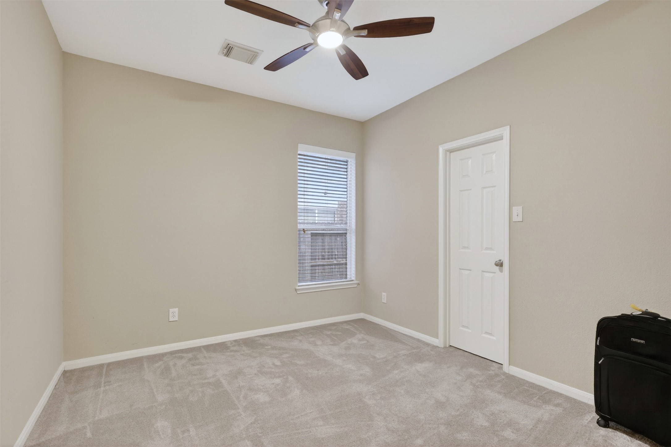 25710 Crisp Spring Lane Spring, TX 77373 - Photo 5 of 37 Secondary Bedroom
Comfortable secondary bedroom with natural light, neutral paint, and ceiling fan—perfect for guests or home office.