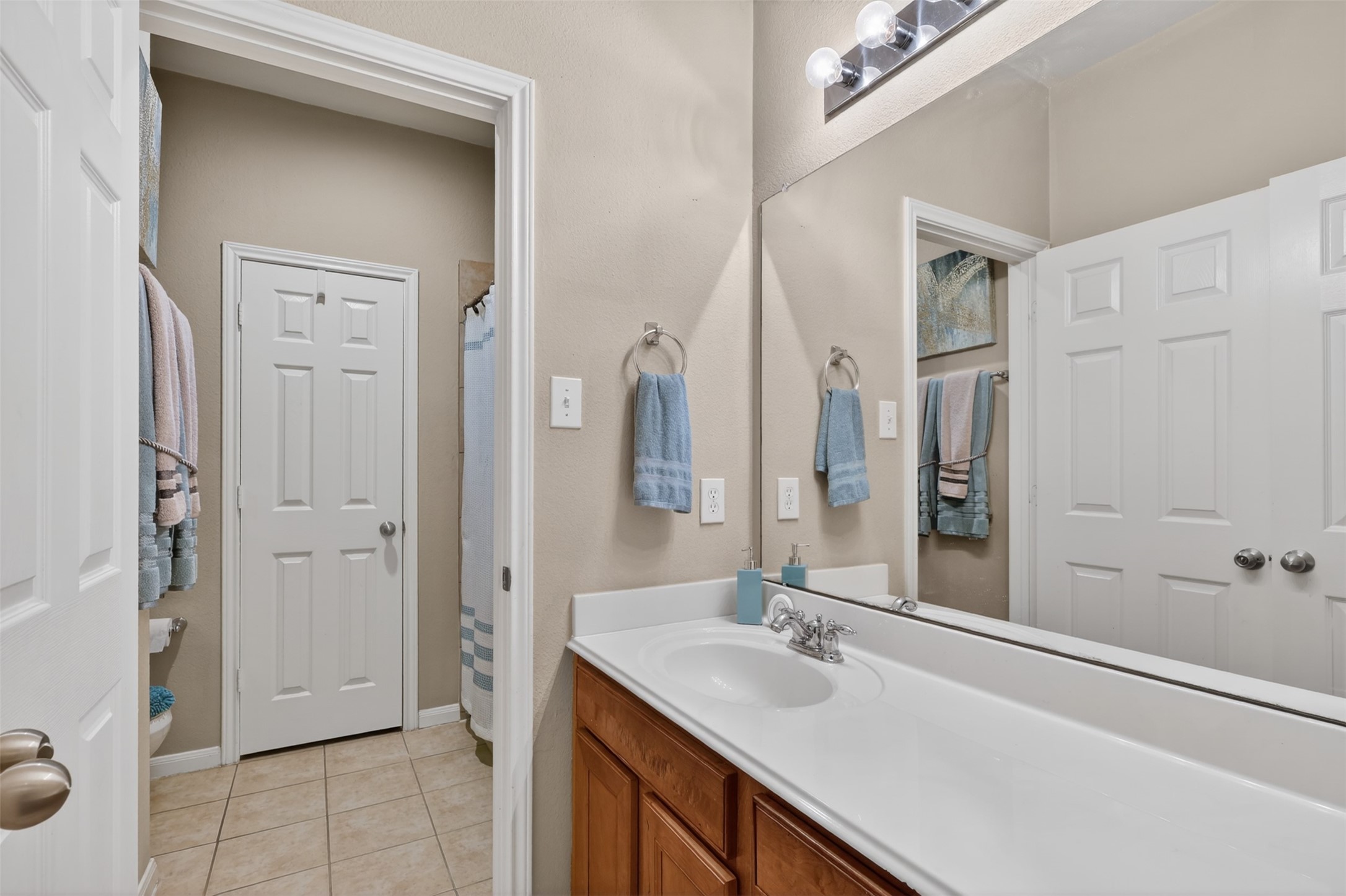 25710 Crisp Spring Lane Spring, TX 77373 - Photo 6 of 37 Secondary Bathroom Vanity
Well-maintained bathroom with extended vanity, ample counter space, and updated lighting.