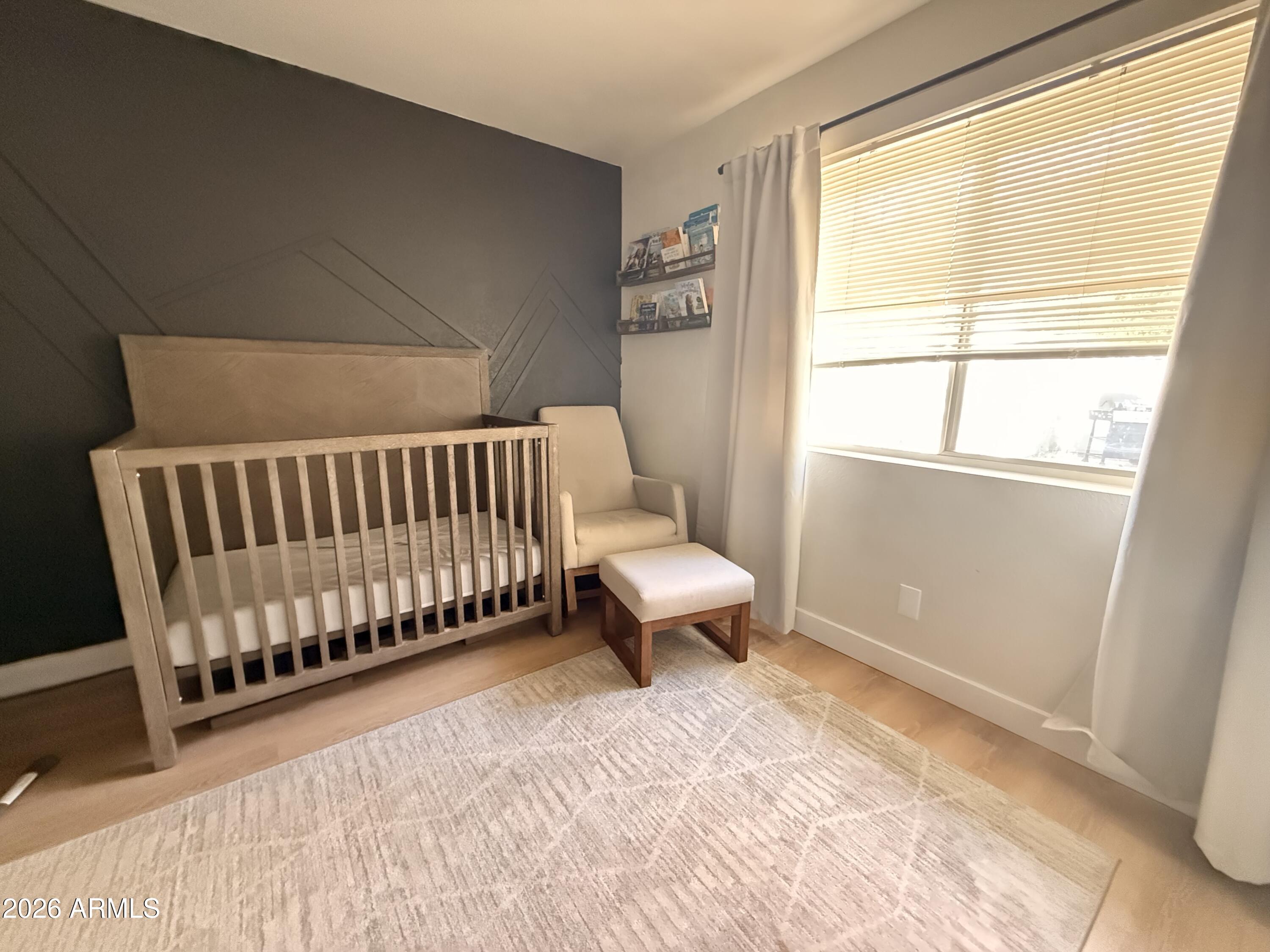 1744 North Ridge Circle Mesa, AZ 85203 - Photo 11 of 14 a spacious bedroom with a bed and a window