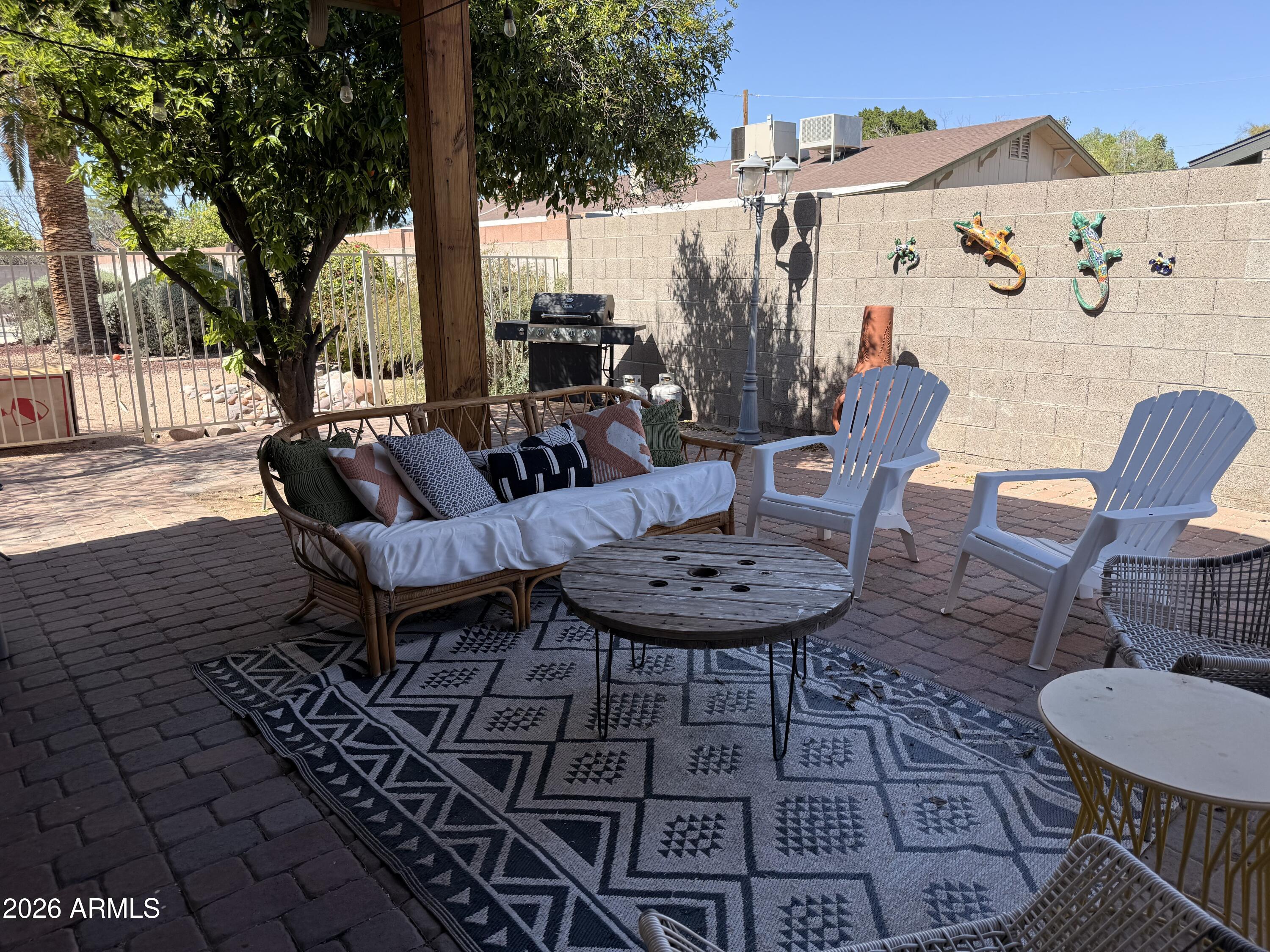 1744 North Ridge Circle Mesa, AZ 85203 - Photo 14 of 14 a view of a chairs and table in the patio