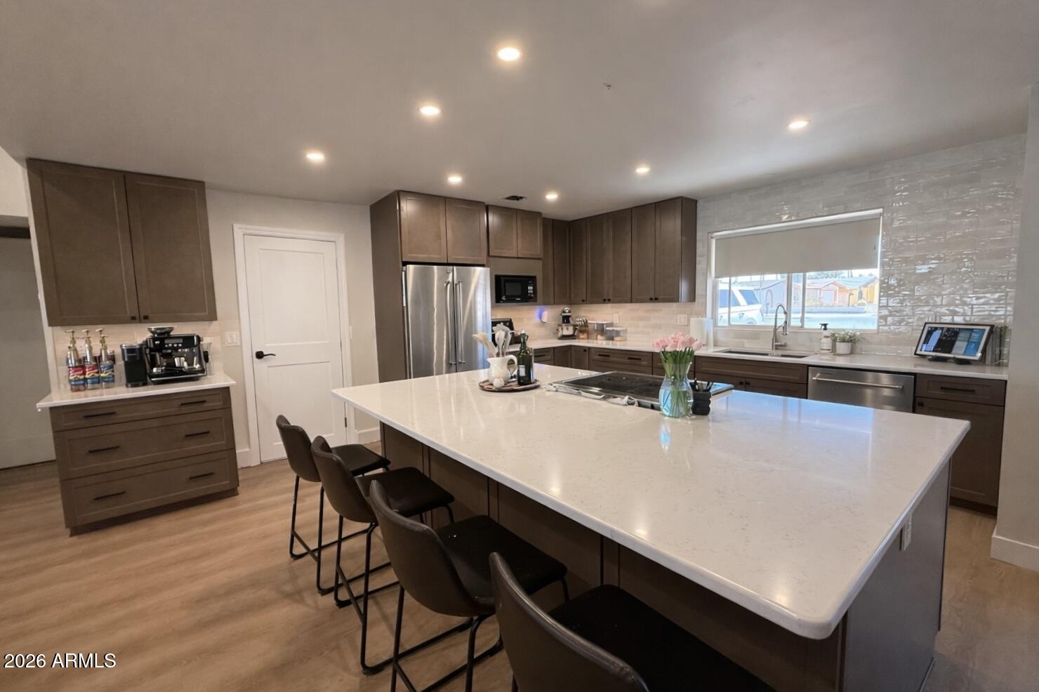 1744 North Ridge Circle Mesa, AZ 85203 - Photo 3 of 14 a large kitchen with a table and chairs