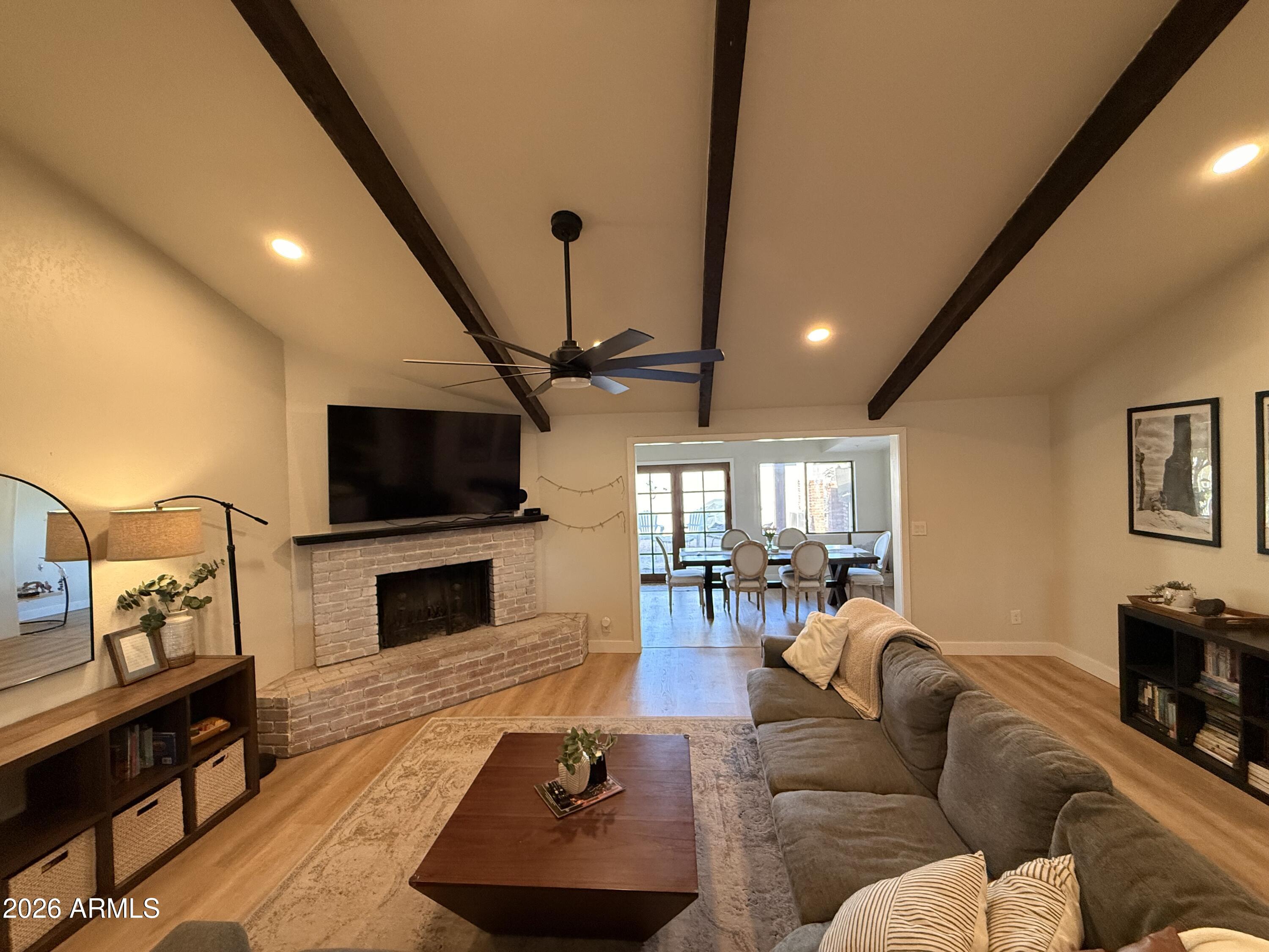 1744 North Ridge Circle Mesa, AZ 85203 - Photo 6 of 14 a living room with furniture and a flat screen tv