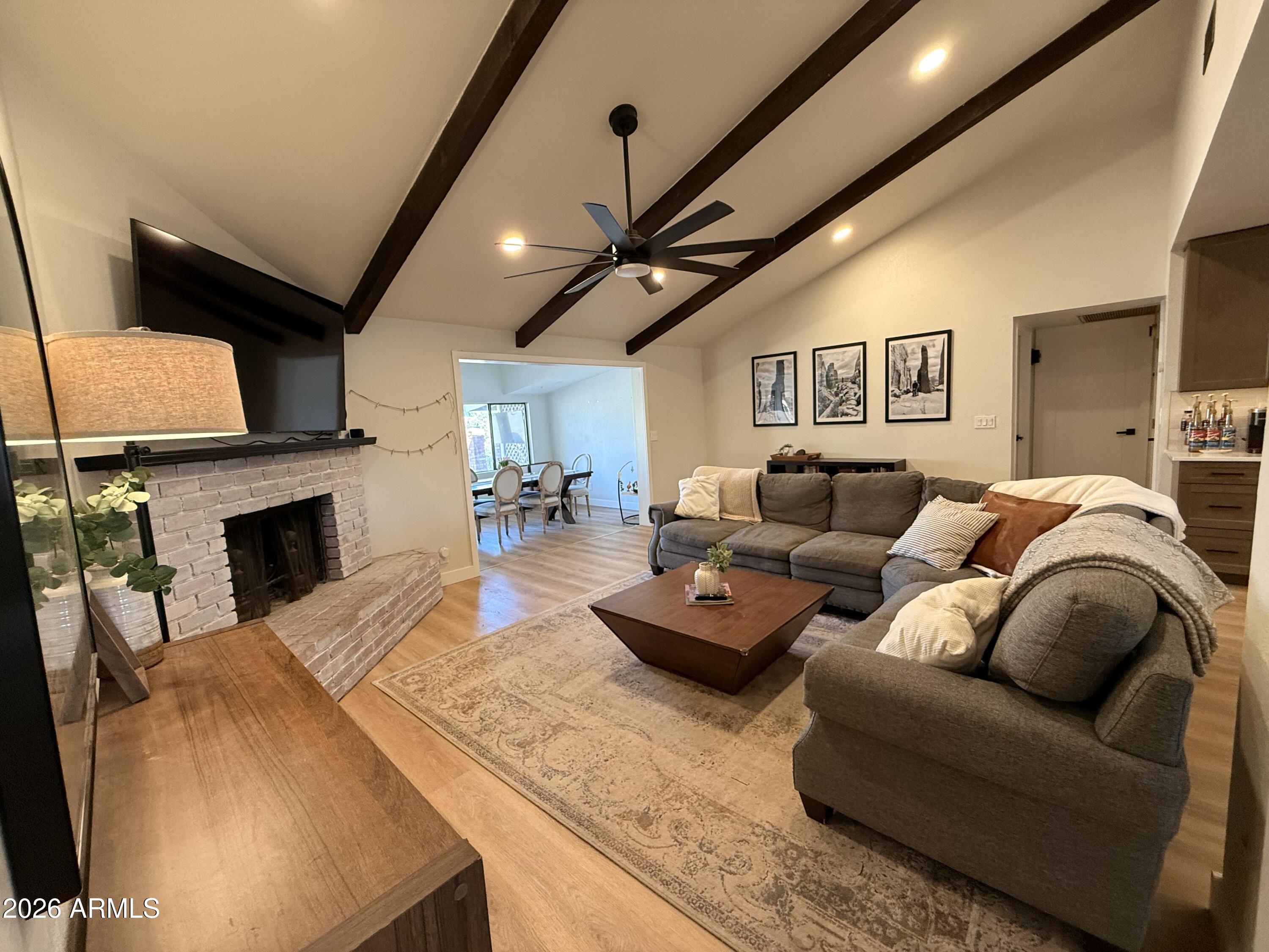 1744 North Ridge Circle Mesa, AZ 85203 - Photo 7 of 14 a living room with furniture a fireplace