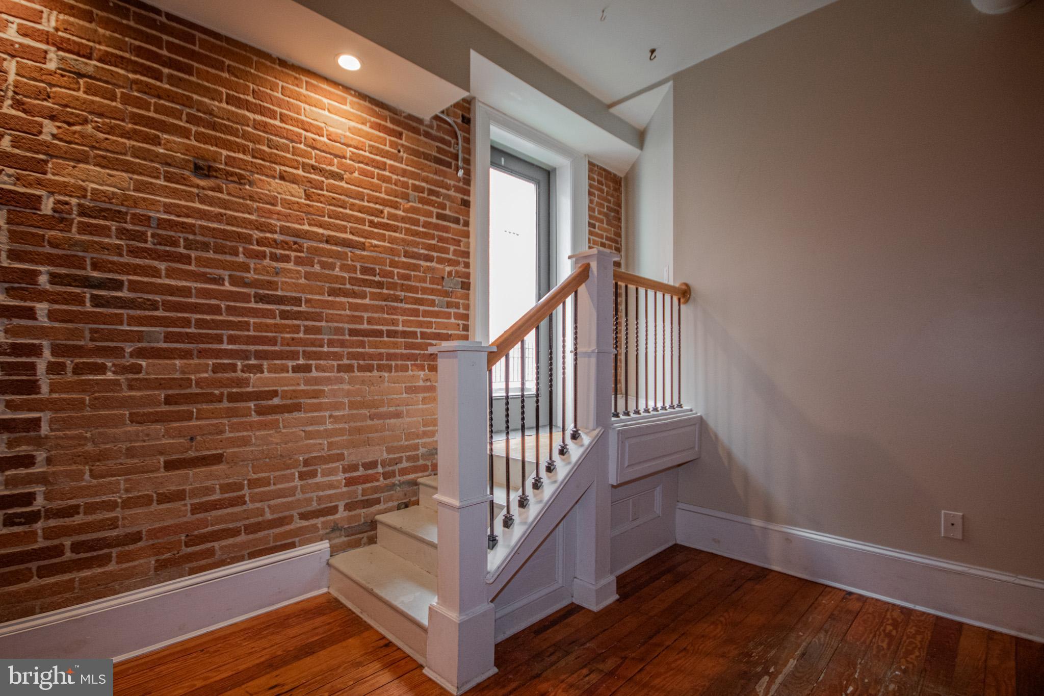 224 West Main Street, Unit 203 Salisbury, MD 21801 - Photo 16 of 20 a view of entryway with stairs and wooden floor