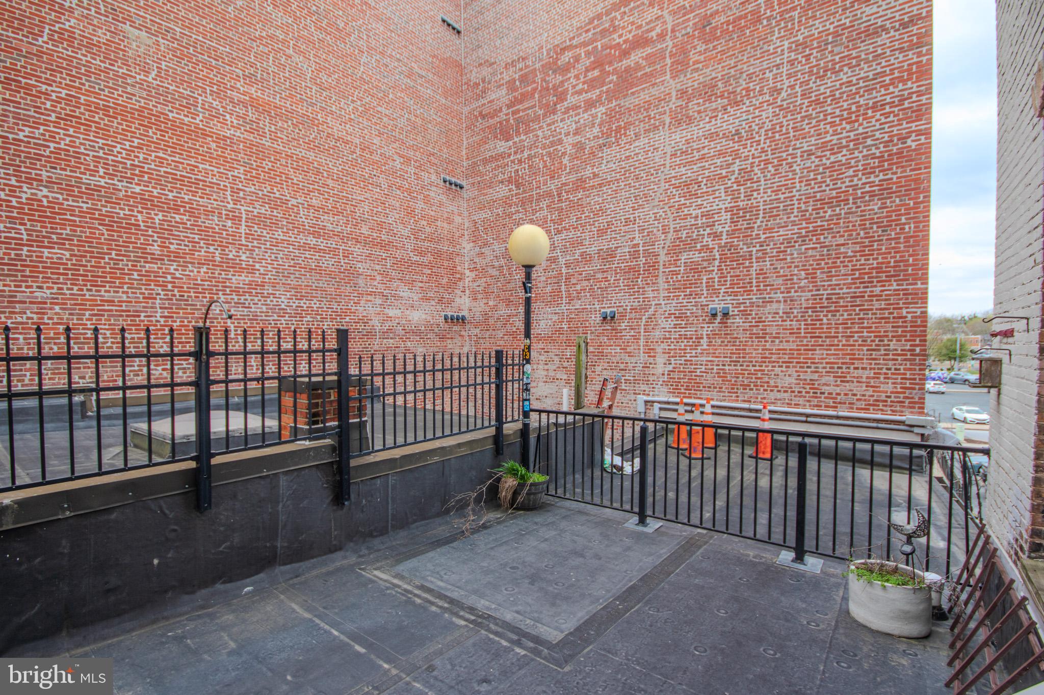 224 West Main Street, Unit 203 Salisbury, MD 21801 - Photo 19 of 20 a view of a terrace with chairs