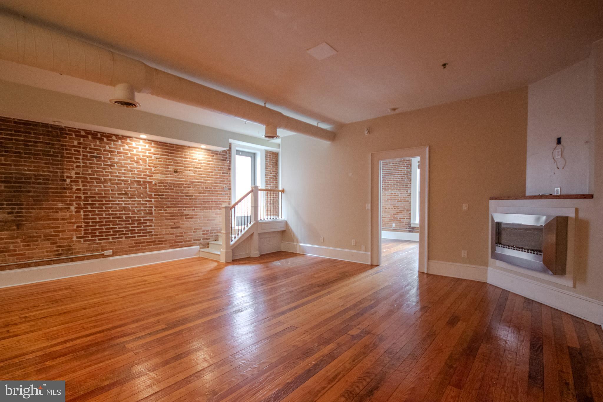 224 West Main Street, Unit 203 Salisbury, MD 21801 - Photo 7 of 20 a view of empty room with wooden floor
