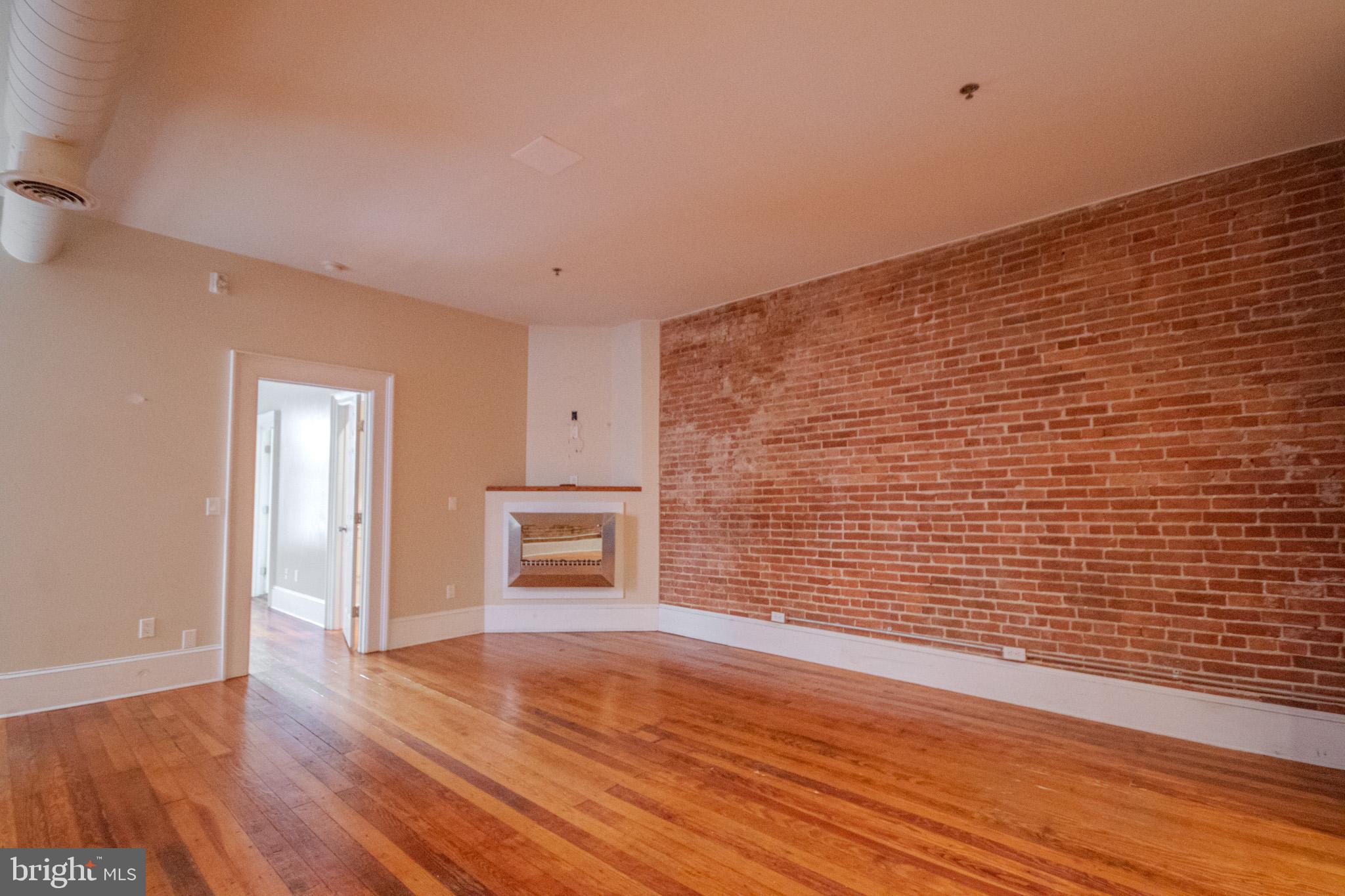 224 West Main Street, Unit 203 Salisbury, MD 21801 - Photo 8 of 20 a view of empty room with wooden floor