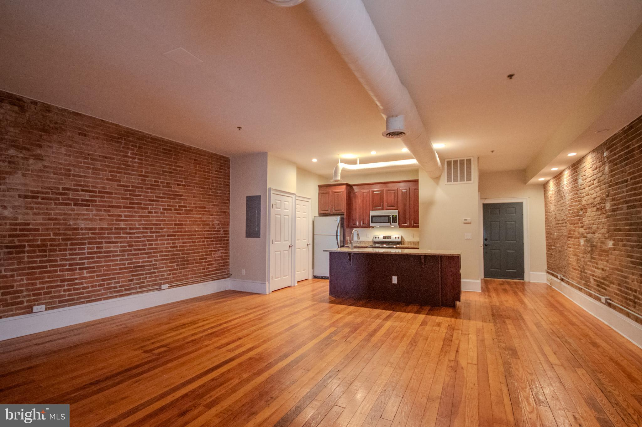 224 West Main Street, Unit 203 Salisbury, MD 21801 - Photo 9 of 20 a large room with kitchen view