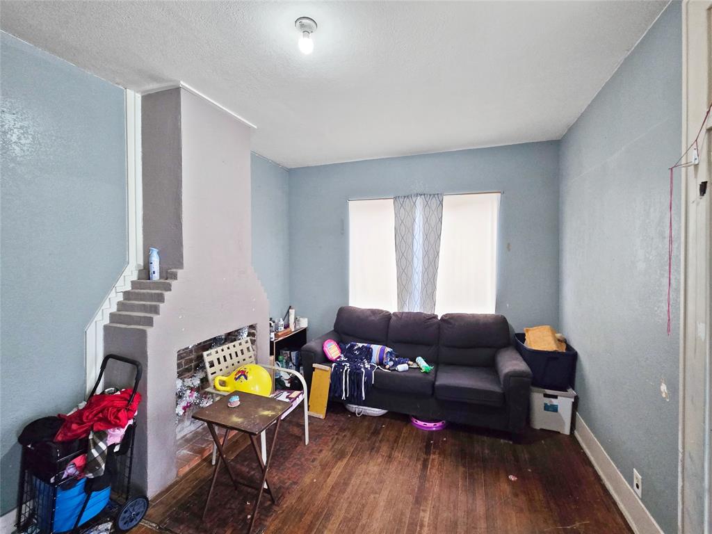 507 West Nash Street Terrell, TX 75160 - Photo 9 of 22 a living room with furniture and wooden floor