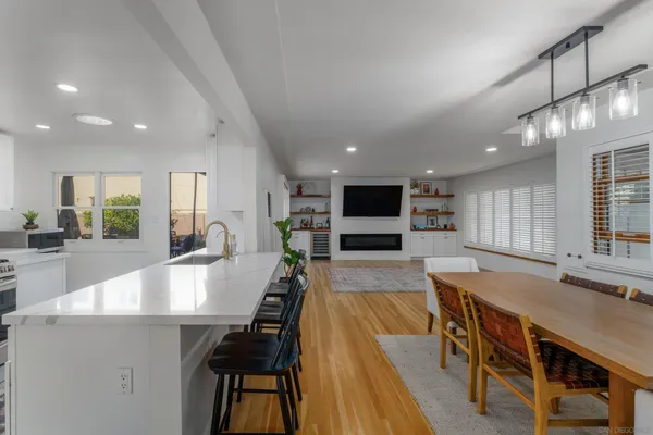a large kitchen with lots of counter space and furniture