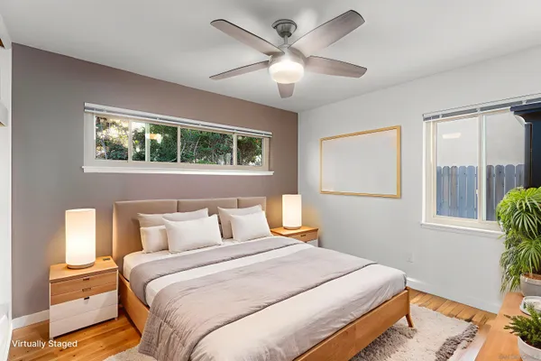 a bedroom with a large bed and a window