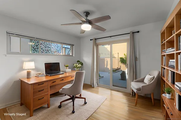 a workspace with furniture and a window