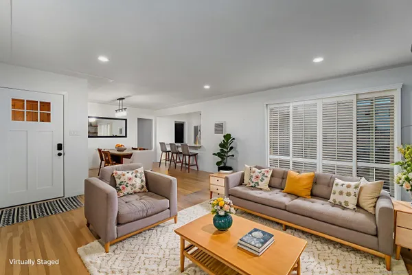 a living room with furniture and a window
