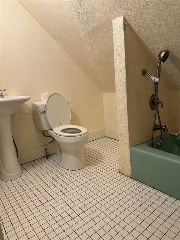 4 Ruthven Street Boston, MA 02121 - Photo 15 of 19 a bathroom with a toilet and a shower