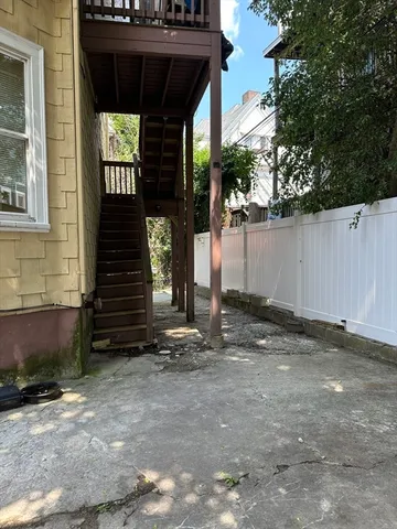 a front view of a house with parking space