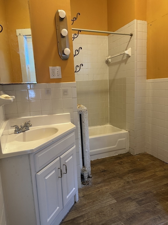 4 Ruthven Street Boston, MA 02121 - Photo 6 of 19 a bathroom with a sink and a bathtub