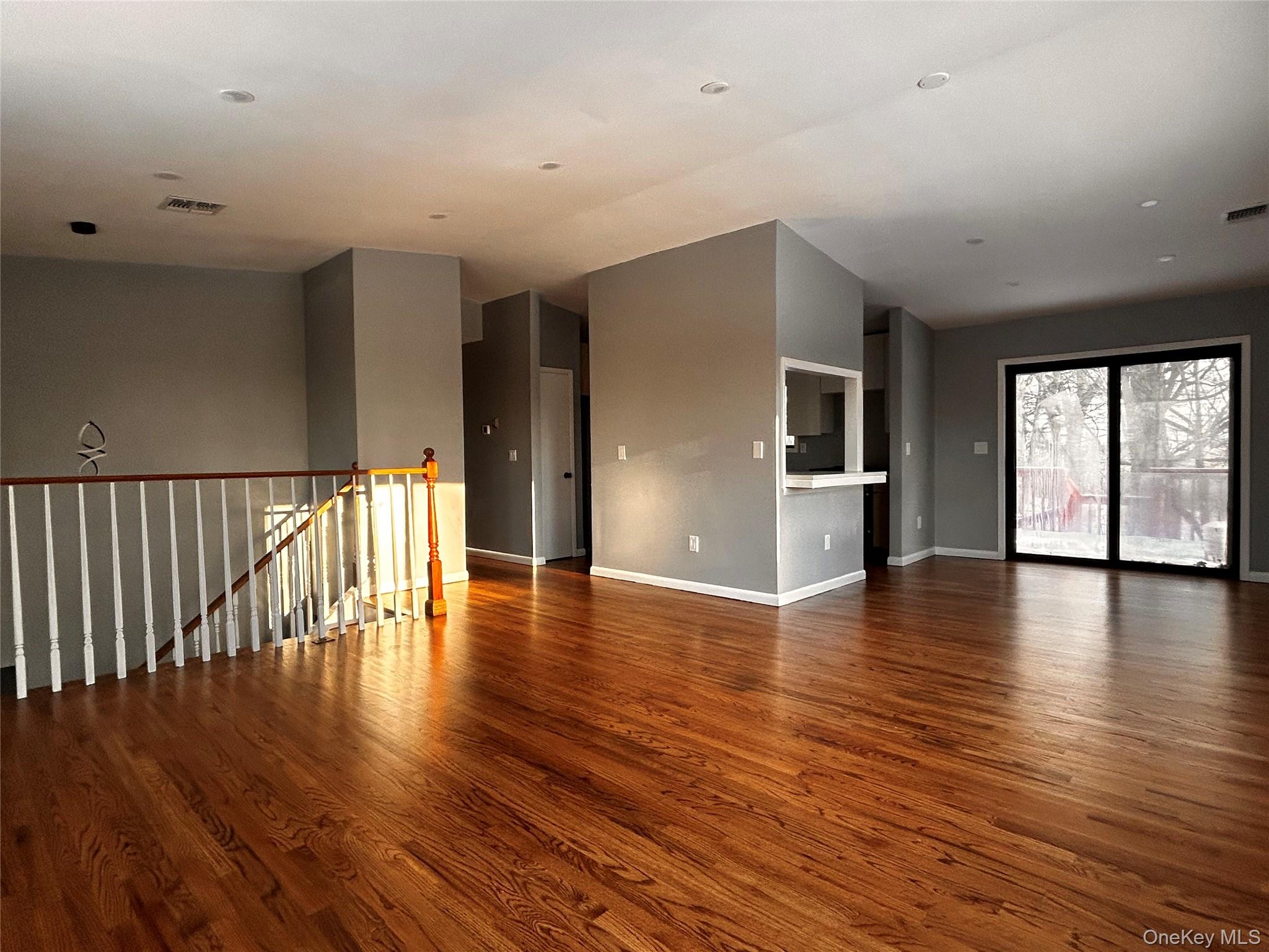 218 Beattie Road Washingtonville, NY 10992 - Photo 3 of 15 Spare room with dark wood-style floors and baseboards
