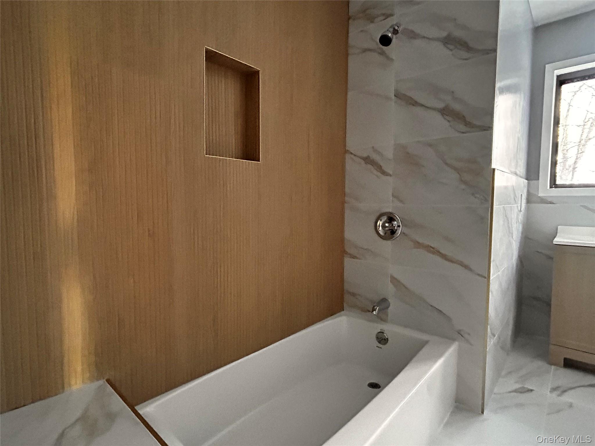 218 Beattie Road Washingtonville, NY 10992 - Photo 8 of 15 Full bath featuring vanity, marble finish floors, and a combined bath / shower with marble appearance