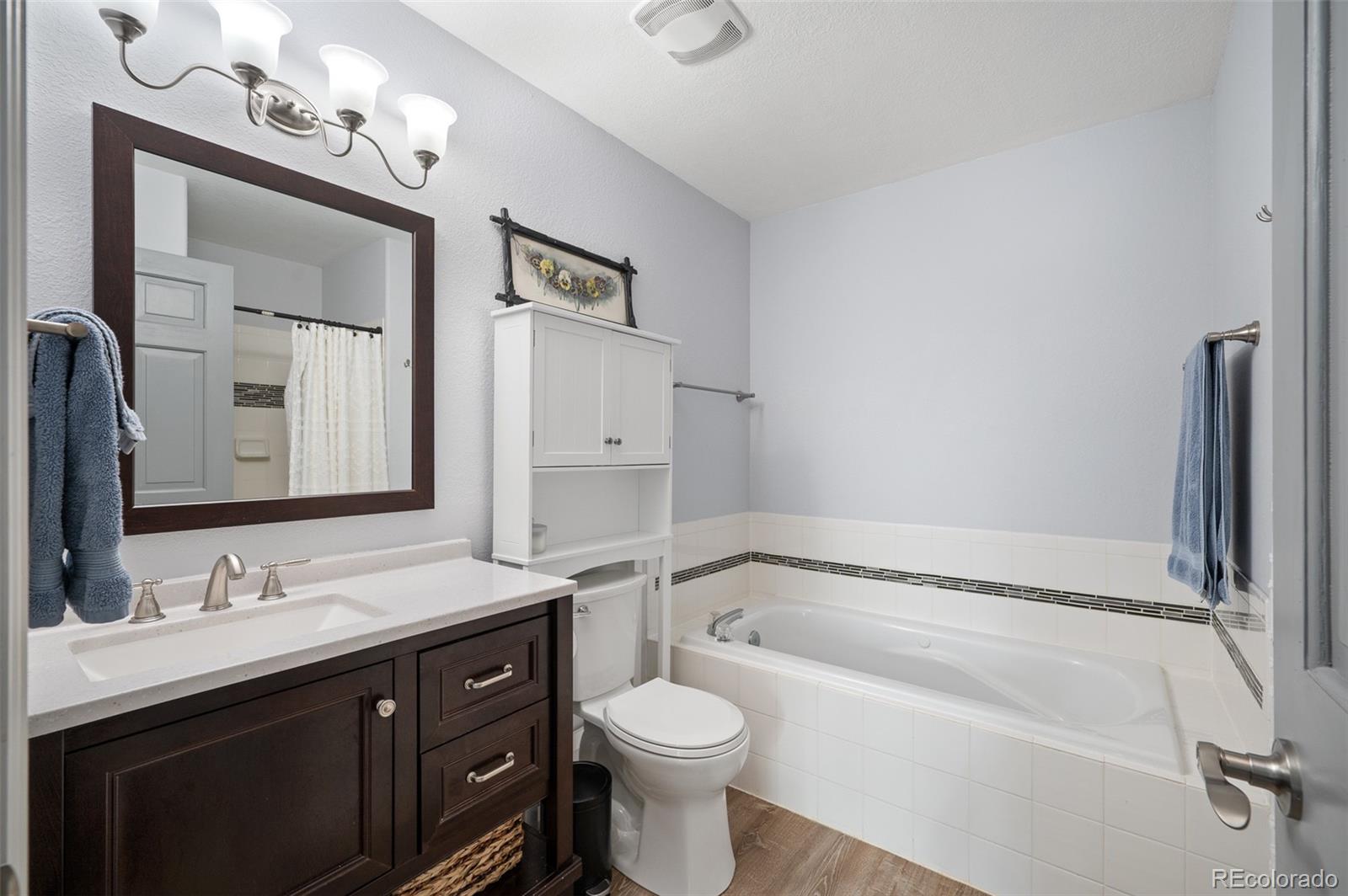 560 Gunsmoke Drive Bailey, CO 80421 - Photo 18 of 43 a bathroom with a sink a toilet and shower