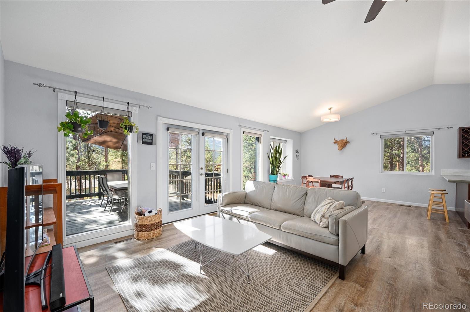 560 Gunsmoke Drive Bailey, CO 80421 - Photo 3 of 43 a living room with furniture and a large window