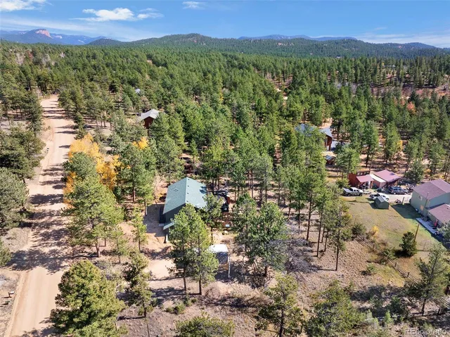a view of a city with green field
