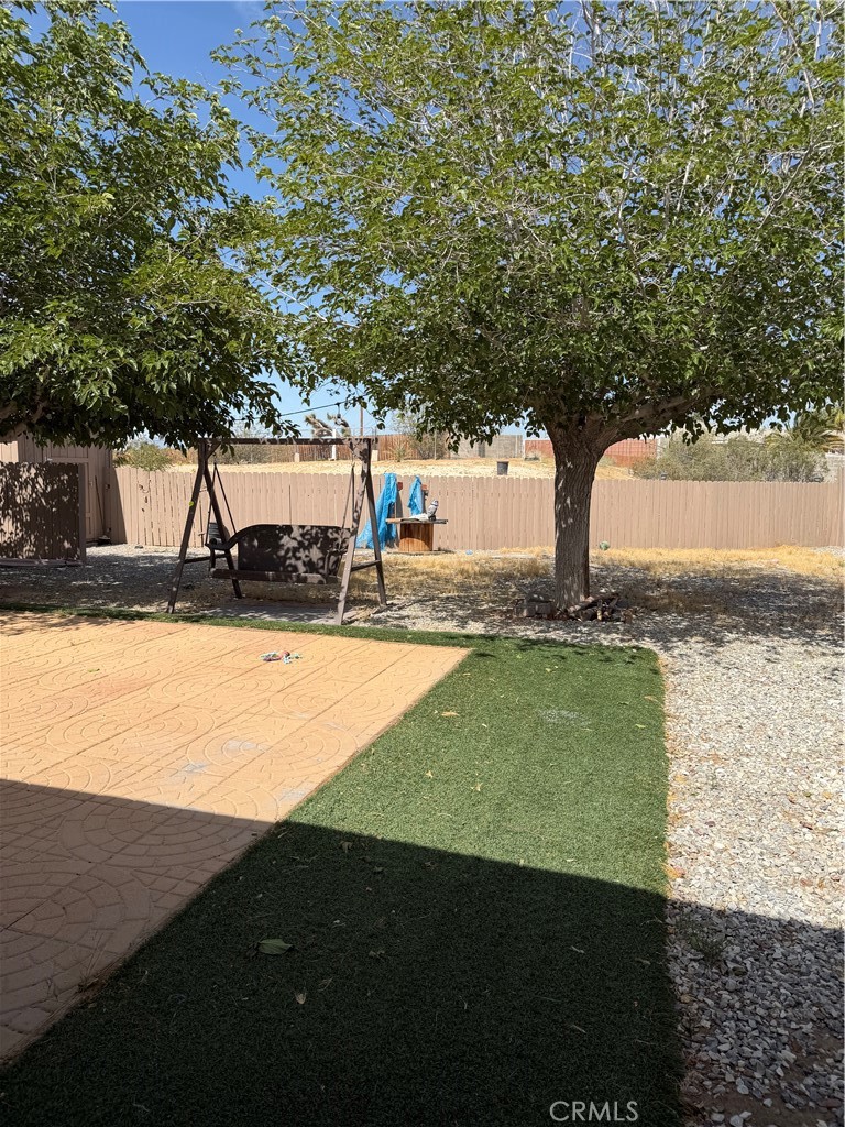 18602 Cocqui Road Apple Valley, CA 92307 - Photo 3 of 16 a view of a yard with an outdoor space