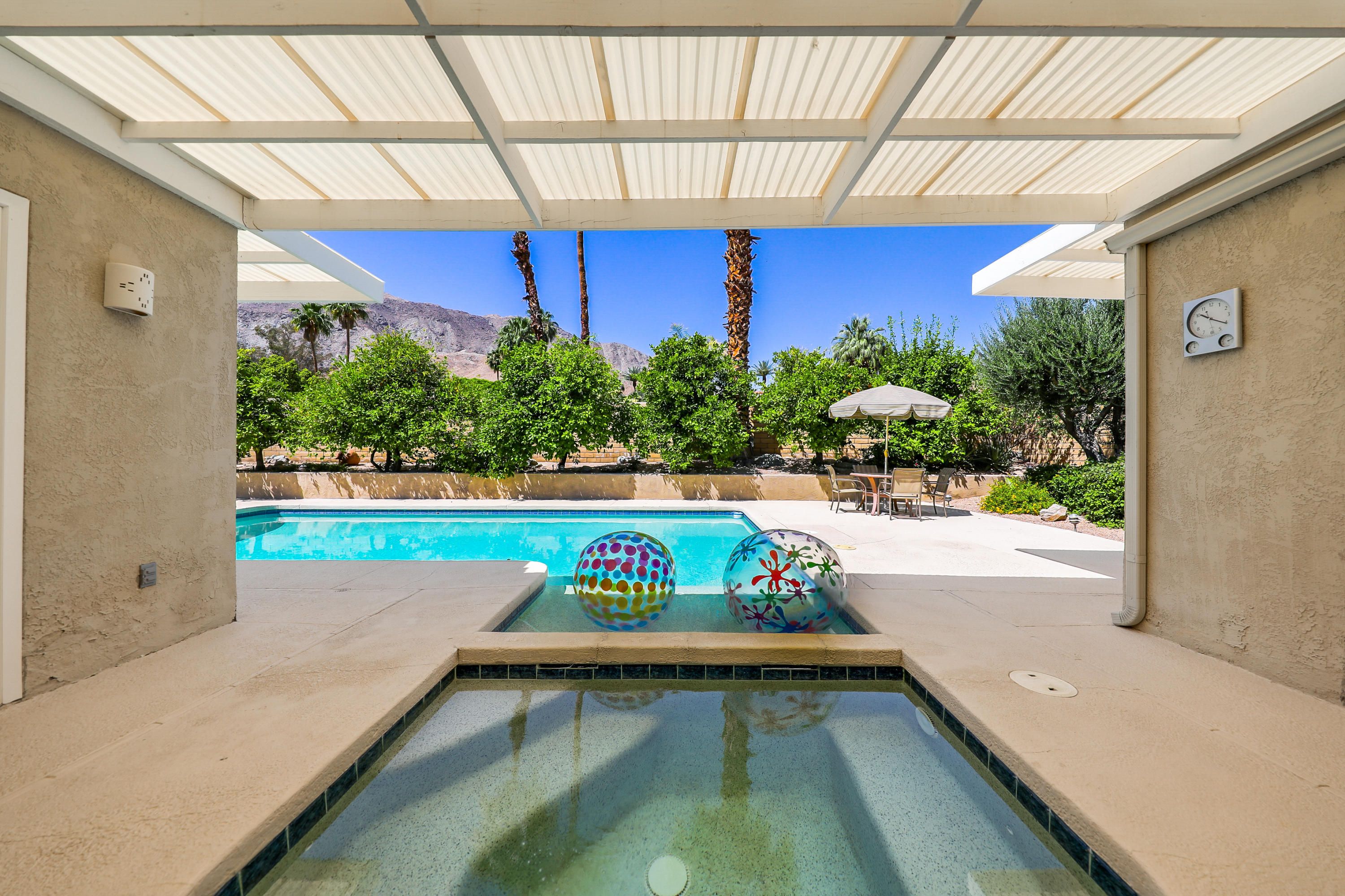 71601 Halgar Road Rancho Mirage, CA 92270 - Photo 1 of 35 a view of swimming pool with a bench in front of it