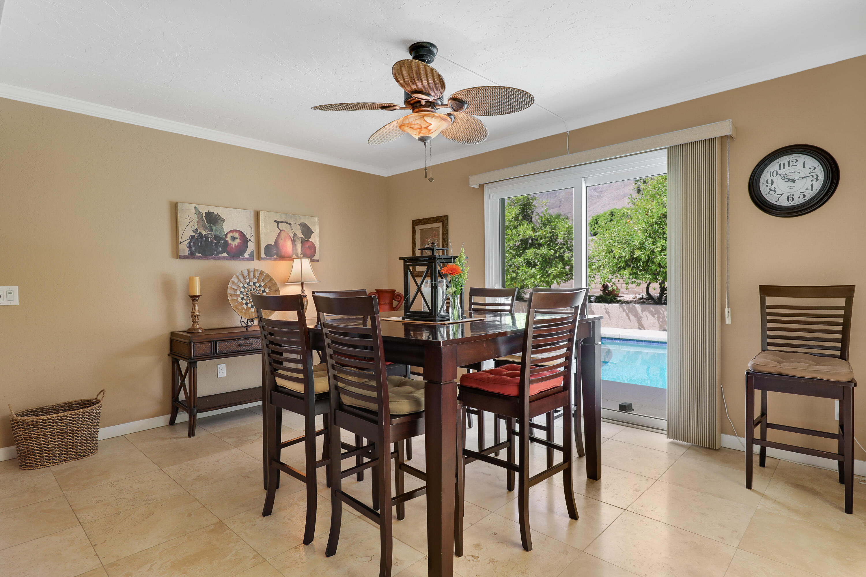71601 Halgar Road Rancho Mirage, CA 92270 - Photo 11 of 35 a dining room with wooden floor a chandelier a wooden table and chairs