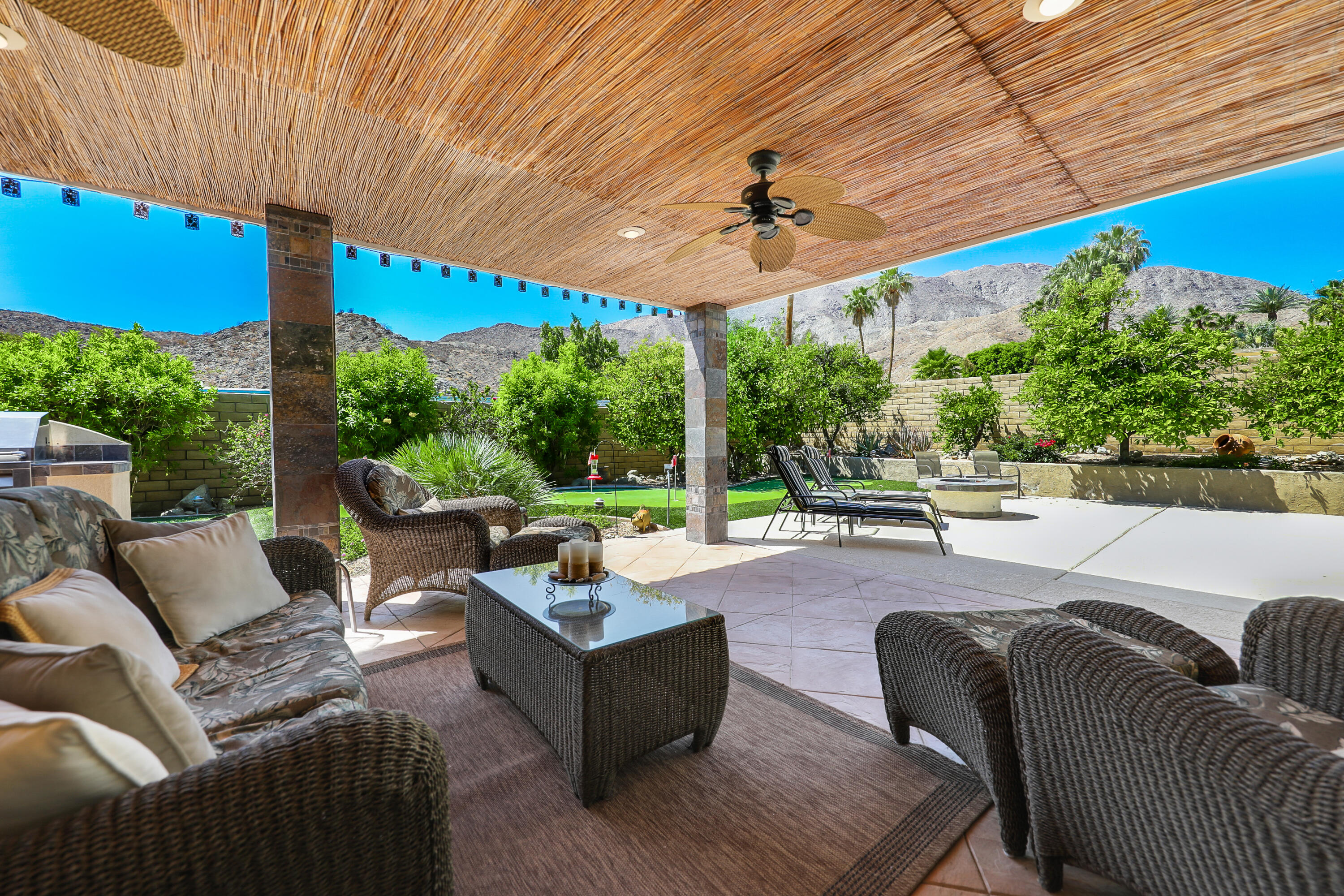 71601 Halgar Road Rancho Mirage, CA 92270 - Photo 15 of 35 a outdoor space with patio the couches and pool table with chairs and umbrella