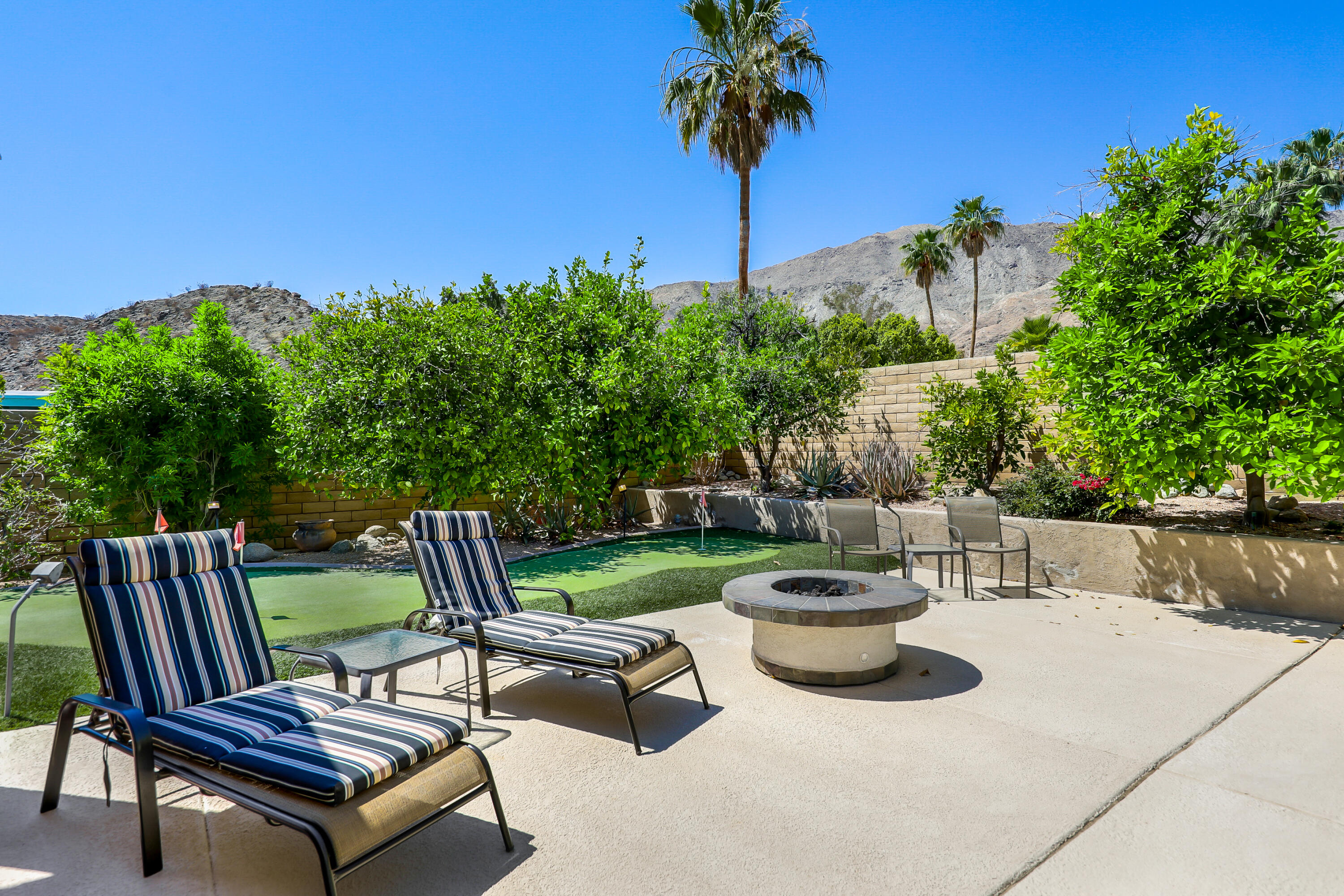 71601 Halgar Road Rancho Mirage, CA 92270 - Photo 16 of 35 a view of a backyard with sitting area and garden